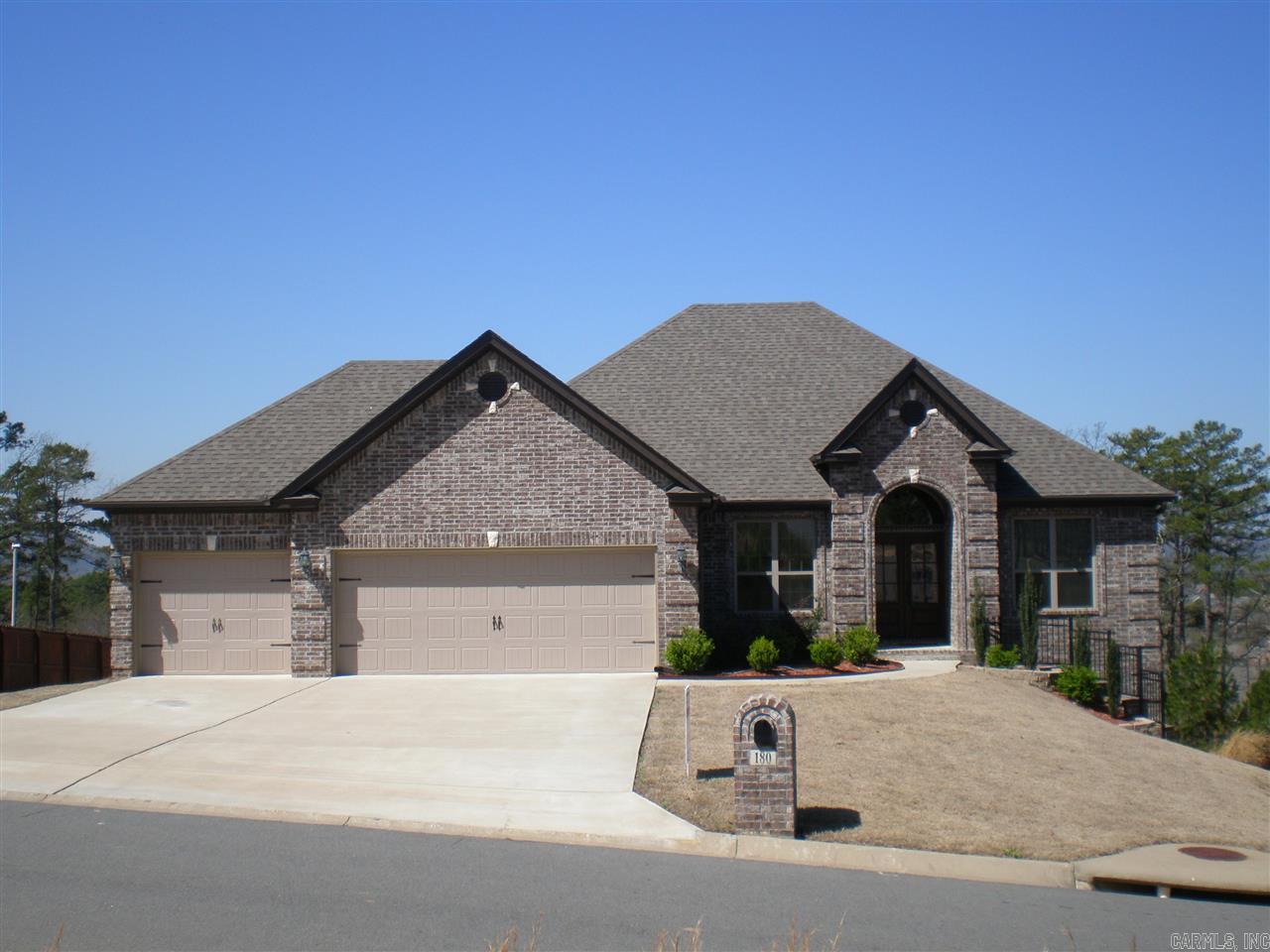 Better than New best describes this 2 level all brick home featuring rear greenbelt , views of Pinnacle Mtn, & Arkansas River. Custom finishes throughout include 9', 10', and 12' ceilings, hardwood floors, study/living room, greatroom opens to granite counter kitchen w/ bay window eating area & breakfast bar. Game/Media room w/ bay window. Master suite with triple windows; Spacious bath has 6' whirlpool, separate shower w/seat, & huge walk-in closet. 2 gas fireplaces & 13x15 covered deck and patio.