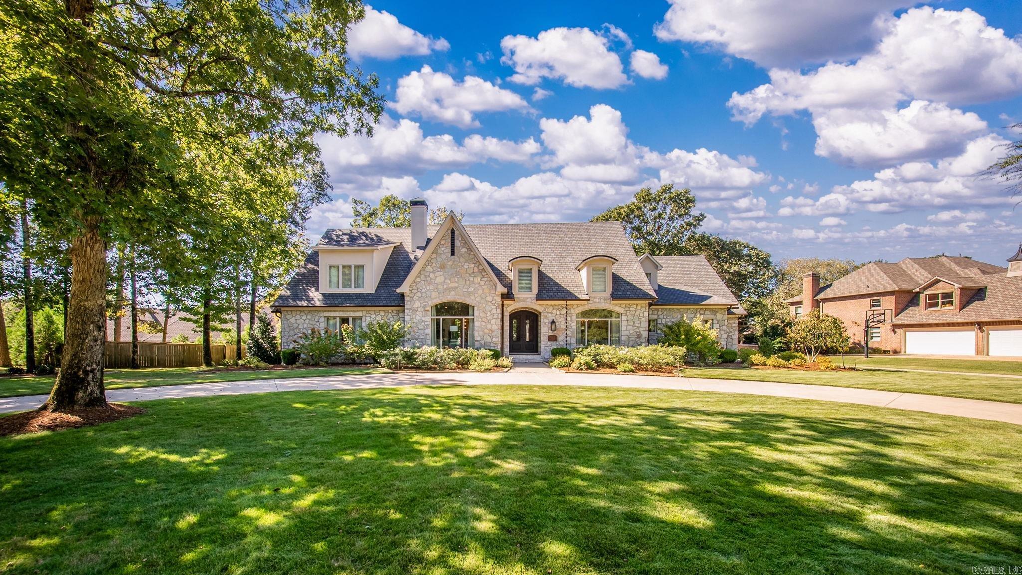 Experience beautiful living in this stunning custom-built residence featuring 5 bedrooms and 5.5 baths, each bedroom with its own ensuite for privacy & convenience. This home was taken to the studs 5 yrs ago & showcases a gorgeous chef’s kitchen complete with marble accents, gallery sink, Miele built-in coffee maker & Bosch & Thermador appliances, as well as multiple stand-alone ice makers—a true entertainer’s dream. The home offers several living spaces both indoors & outdoors, a billiard room, exercise room & a media room with surround sound throughout. 2 gas log fireplaces add warmth & sophistication to the living areas. The primary suite is a retreat of its own, boasting electric drapes, heated floors in the bathroom & closets, a 2nd washer & dryer set, steam closet, beverage refrigerator, & Toto toilets. Both primary closets are amazing! Full guest suite separate from other bedrooms with kitchenette. Step outside to your private resort-style pool & firepit, surrounded by multiple sitting areas & a fully equipped-covered outdoor kitchen. Complete with landscape lighting & 3-car garage, every detail has been thoughtfully designed for luxury & comfort with a designer’s style.