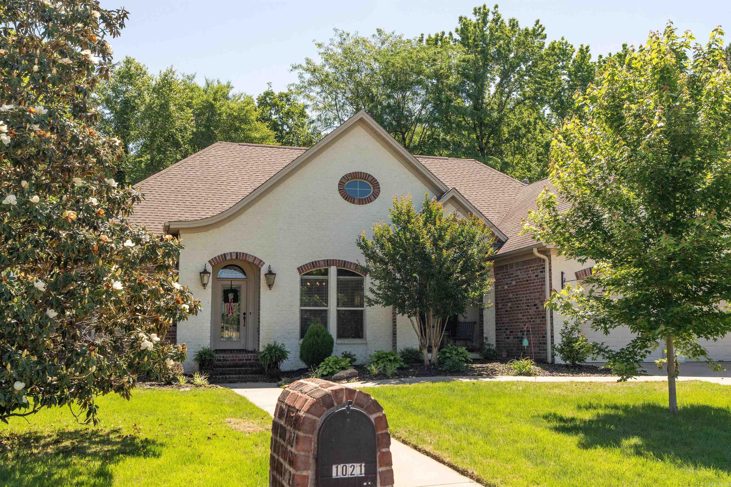 Welcome to this stunning 3-bedroom, 2-bath home featuring a desirable split-bedroom layout and an open-concept floor plan designed for comfortable living and entertaining. Located in a newer neighborhood on the west side of Searcy, this home combines charm, privacy and modern convenience.  The spacious kitchen offers a casual eat-in dining area, while a separate dining room provides the perfect setting for gatherings and special occasions.  One of the home's standout features is the large sun porch with a cozy fireplace, offering year-round enjoyment and beautiful views of the backyard. Step outside to your private outdoor retreat featuring a patio, fire pit, and a wooded backdrop that provides exceptional privacy and a peaceful setting.