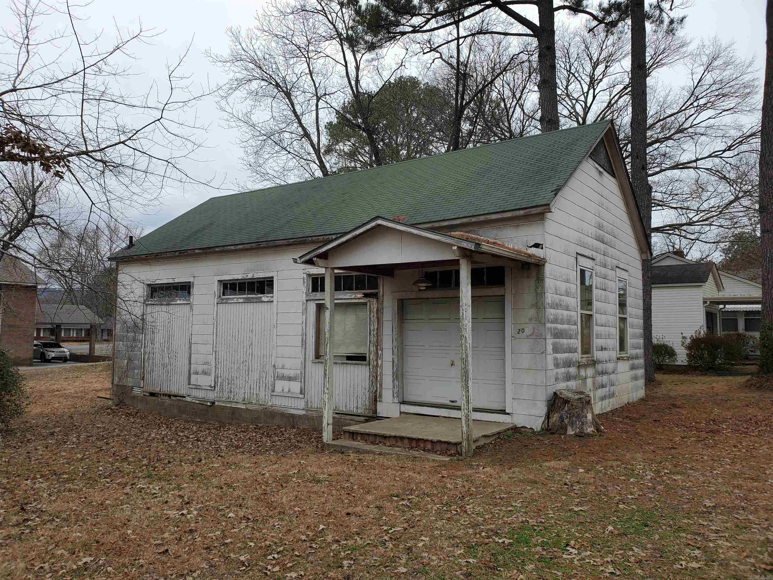 County records show this building to be 50 years old but it looks like 1920's to 1950's construction. Currently used for storage and is in need of some repairs.  No utilities are currently in use but has had them in the past. Nice level area for parking if needed.  Priced to sell and will make an excellent shop, storage building or business. Zoned C1. Come check out this incredible value!!