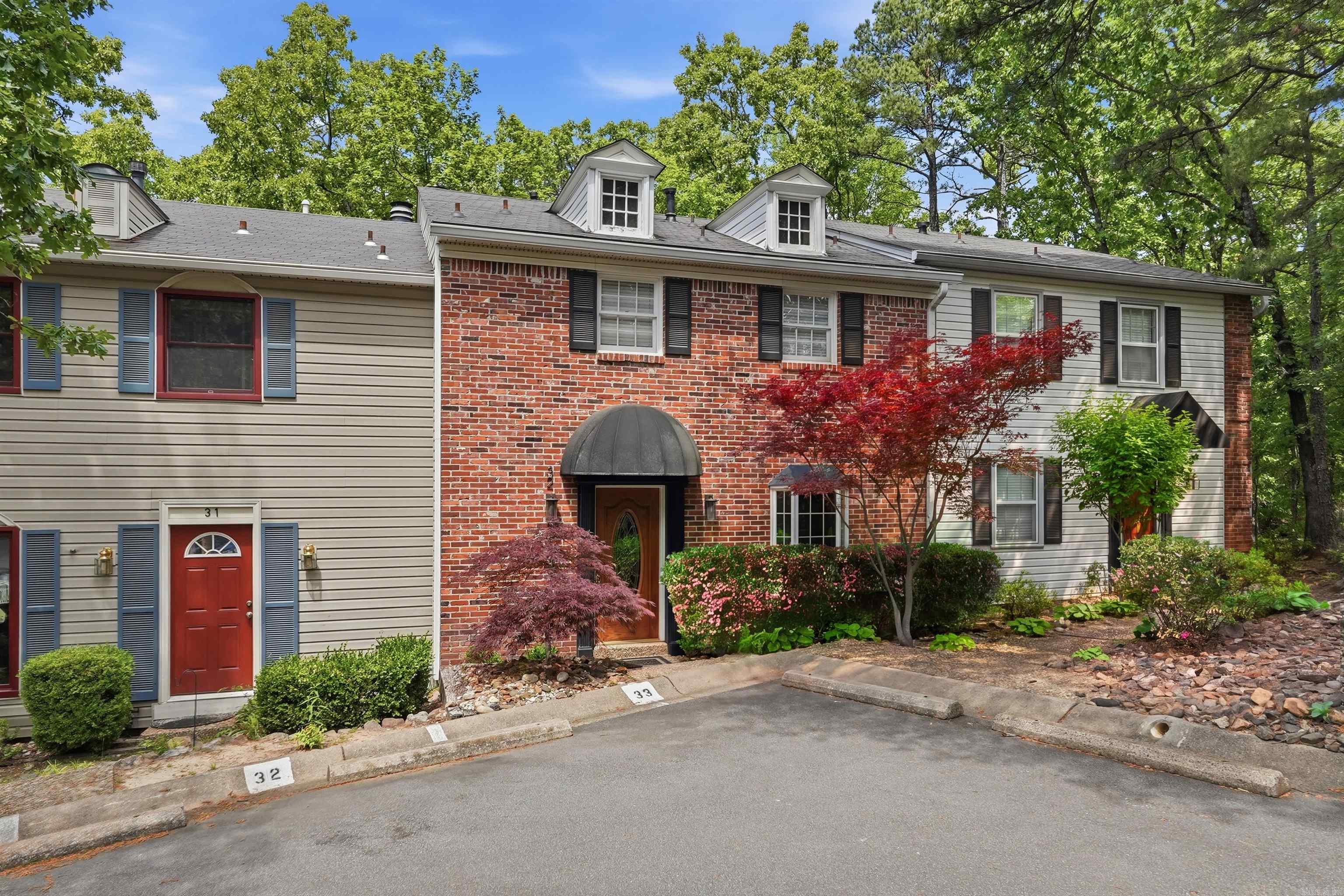 Beautiful complex; it's like stepping back in time to an English Village.  Each townhome is uniquely designed and individualized.  This townhome is two stories with a lovely kitchen, fireplace, dining area and fireplace downstairs.  Bedrooms are located upstairs.  The complex features a pool, picnic are, tennis courts and a club house.  This community is conveniently located in west Little Rock; near restaurants and shopping. This unit also includes a full-size Murphy bed in the guest bedroom, a private outdoor living area with a hot tub and a storage area.  Hurry; before this beauty is gone! *AGENTS SEE REMARKS*