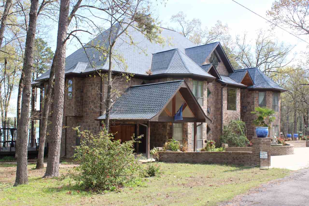 LAKEFRONT PARADISE on 3 lake lots! - This 6-bedroom spectacular lakefront home has everything for full-time or part-time living and entertaining on Greers Ferry Lake!  Open floorplan, soaring ceilings, lots of Andersen windows, 30' tall fireplace, bar with seating, breakfast bar that seats 10, Thermador appliances, 8-burner stove, concrete floors, bamboo & travertine floors, garage, very large multi-level decks with wonderful lake views!  Easy walk to the water, 3-18 seer A/C units & much more!!