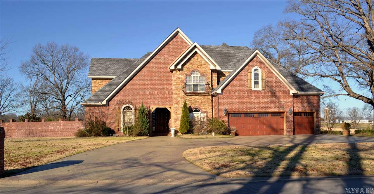 Beautiful  home located on 4.35 acres overlooking a beautiful pond. Large shop, inground pool. Custom chef's kitchen w/ Wolf gas range, large center island, brick flooring, granite counter tops, hearth area, corner FP, breakfast area, large office/mud room, formal dining, large great room, WBFP & Built Ins. Master Bedroom suite on main level with fireplace, tile shower, soaking tub, huge walk in closet. The Grand staircase leads to 4 bedrooms/3 baths upstairs and a bonus area.DO NOT USE AS A COMP!!!