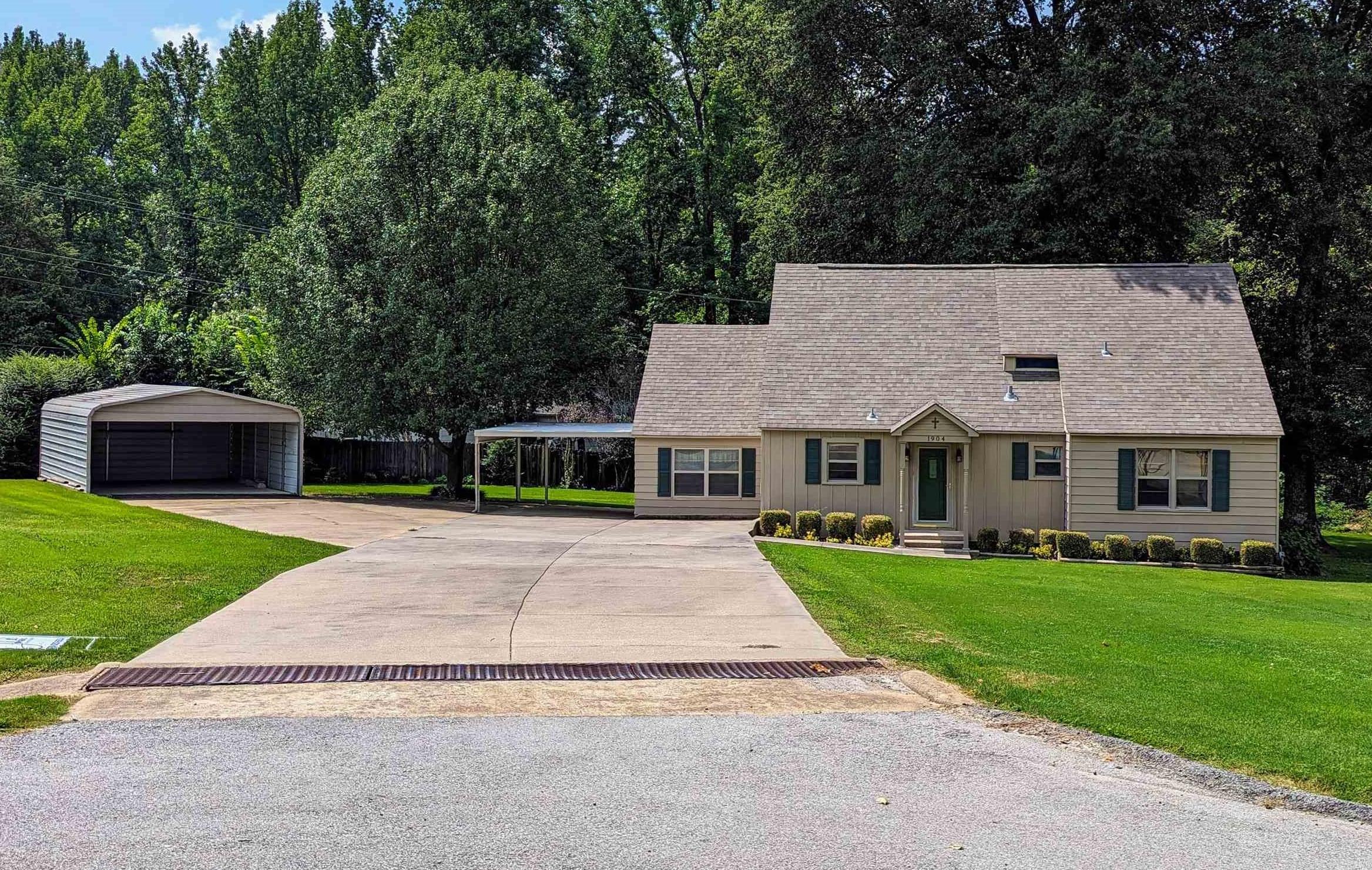Spectacular curb appeal draws you onto this very pretty half-acre lot with mature shade trees, well-manicured lawn, and landscaping. Inside this 2-level, 4 bedroom & 2 bath home located in the Sunset Hills Subdivision you will find an immaculate home displaying original knotty-pine in the living room and a guest room that adds a touch of yesteryear and a warm, rustic feel. The picture window offers a tranquil view of the expansive, beautiful yard. The kitchen has a lot of cabinet and counter space to please any cook! There are 2 bedrooms and a full bath on each level. Recent updates include a roof in 2021 and AC in 2019. Large concrete driveway with a 1-car attached carport plus additional parking in the 14x25 detached, carport (add a wall & overhead door for a workshop) and there is a small storage building as well. Out back, there is a large deck made from composite to enjoy the coming breezy fall days. *Year built is approximate. This property is for sale AS-IS.    ''Don’t Buy Or Sell Alone!” LEGAL DESCRIPTION: All of Lot 18 & West 1/3 of Lot 17, Sunset Hills Subdivision, city of Paragould, Greene County, AR.