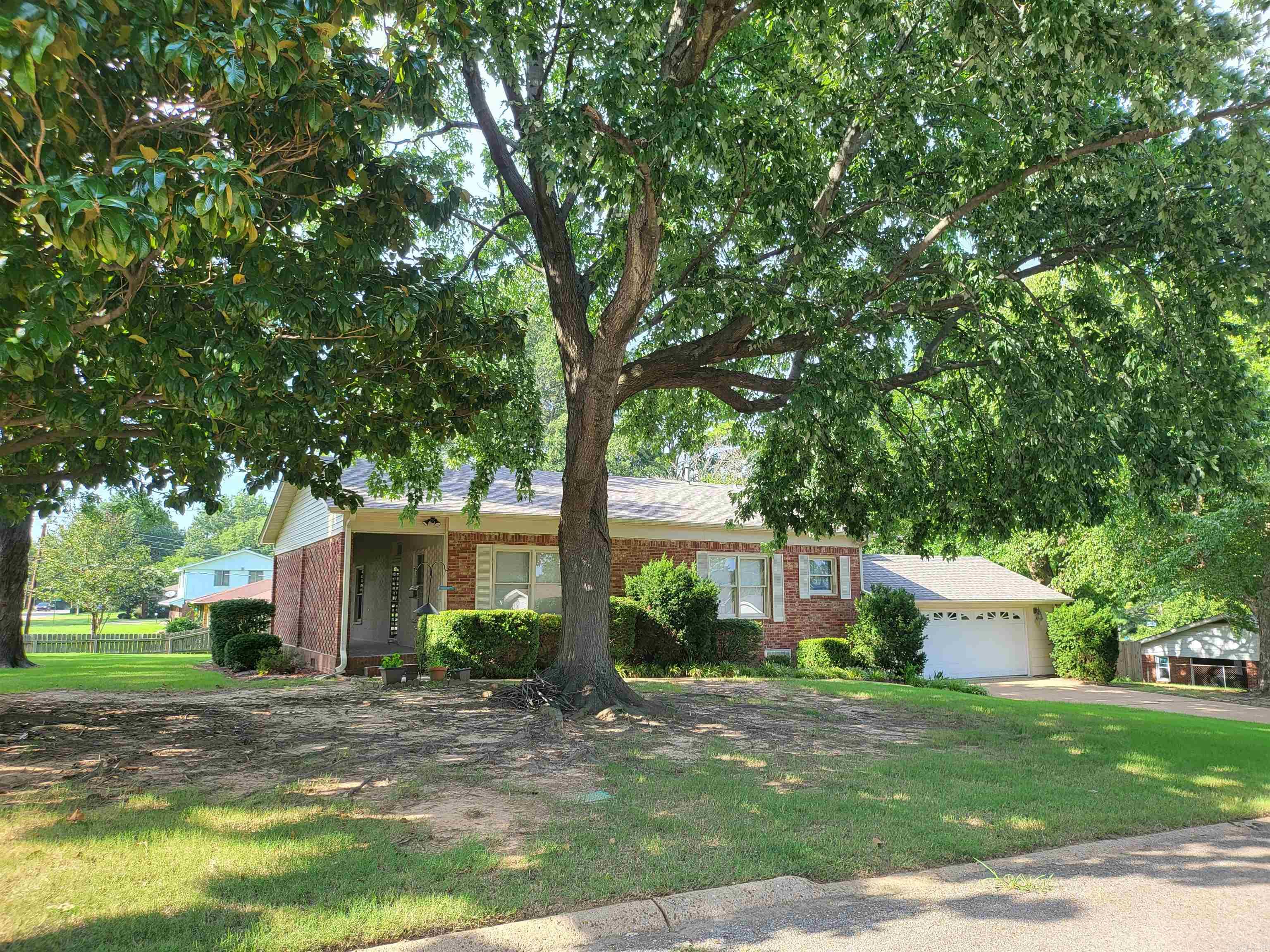Welcome to 918 Twin Oaks Ave, Jonesboro, AR! This delightful 3-bedroom, 2-bath home is overflowing with timeless charm and character. From the original hardwood floors and soaring 12-foot ceilings to the oversized windows, formal dining room, and antique light fixtures in the front bedroom and on the welcoming front porch, every detail reflects the warmth and craftsmanship of a bygone era.  The spacious bedrooms, cozy front porch, and inviting backyard patio make this home perfect for relaxing or entertaining. Situated on a beautiful corner lot, you'll enjoy mature shade trees, a fenced backyard, and a storm cellar for added convenience. Recent improvements include a new roof, new exterior paint, and new gutters—all completed in 2025. Conveniently located near the Southwest Drive exit on I-555, this home offers easy access to shopping, dining, schools, and more. If you've been searching for a home with authentic character, timeless appeal, and a wonderful location, this is one you don't want to miss. Call today to schedule your private showing!