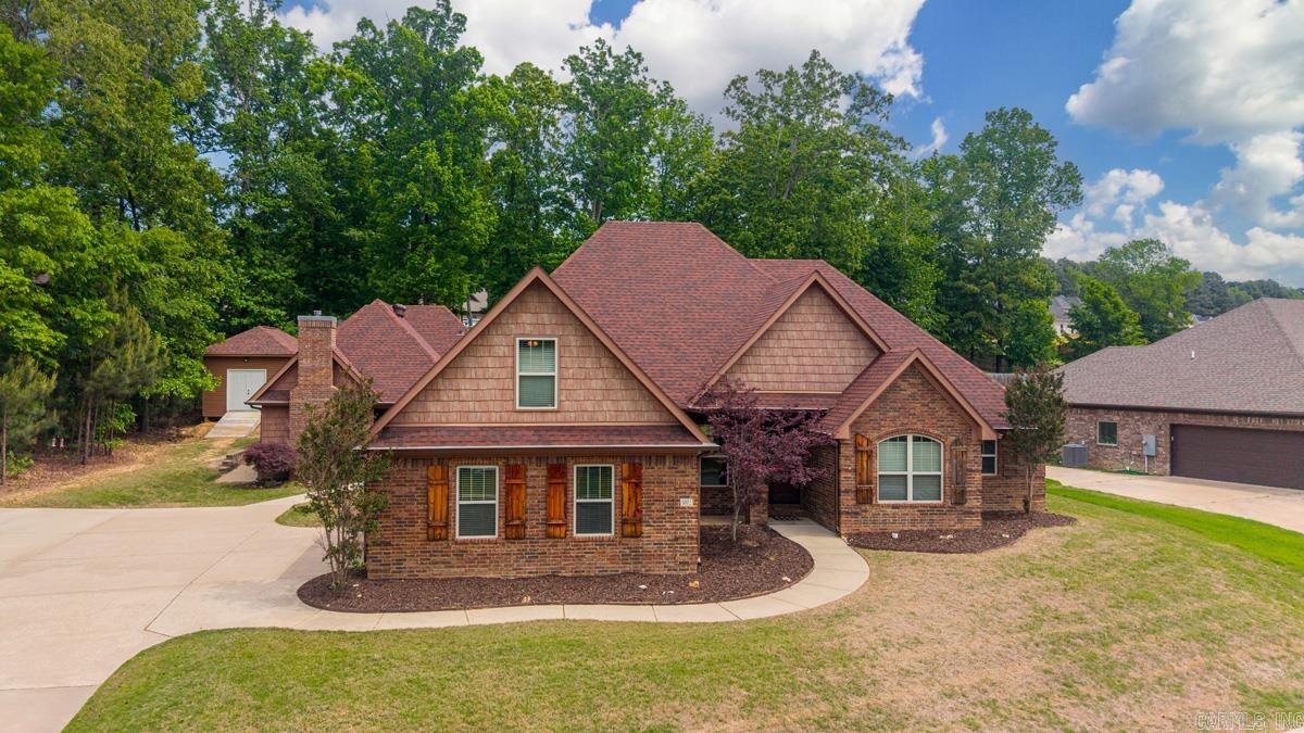 Welcome to this spacious 3,682 sq ft traditional-style home built in 2013 on a generous 0.41-acre lot in highly desirable The Woodlands subdivision. Featuring 5 bedrooms and 4 full bathrooms, this well-maintained property offers ample living space with a flexible layout perfect for families or multi-generational living. Highlights include a large upstairs bonus room, custom built-in-law quarters, updated stainless steel appliances, crown molding throughout and new roof in 2022.  Outside, enjoy the in ground sports pool, patio/porch areas for entertaining and private backyard. Other exterior amenities include: wood privacy fencing, guttering, Storage building/Shed and a 2-car side-entry garage. The private in-law quarters has it all, including a fully functional kitchen, living area, nice sized bedroom, bath and large closet, plus separate laundry room. This one of a kind home is conveniently situated near schools and amenities in Benton with easy access via Congo Road. A fantastic opportunity in a family-friendly neighborhood known for its community feel, featuring neighborhood amenities, including a pool, scenic walking trails, and a playground. Agents please see Conf. remarks.