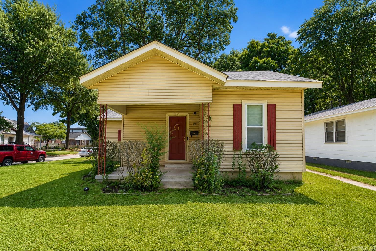 Discover this beautifully functional 1,335 SqFt single-story residence situated perfectly on a low-maintenance corner lot in Blytheville. Built in 1955, this traditional 3-bedroom, 2-bathroom home offers a fantastic layout featuring a front-facing master bedroom and an incredible bonus feature: a dedicated private office space that is perfect for remote work or study!  The interior delivers exceptional peace of mind, fully equipped with an integrated security system, smoke alarms, and a built-in saferoom. Enjoy everyday convenience with central heating and air, ceiling fans, a built-in dishwasher, and a reliable gas water heater. Step outside to relax on the open front porch, or enjoy the privacy of the fully fenced backyard—ideal for pets, gardening, or outdoor play.    Located near Blytheville Elementary, Middle, and High Schools, this property is completely vacant and incredibly easy to show. Don't miss out on this fantastic opportunity, schedule your private tour today!