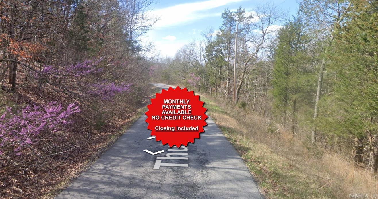County appraised value $19,000. Owner-finance available for easy terms. You cannot camp or park a trailer on the lot. No mobile homes but other types of housing is allowed. Not far from Eureka Springs, the Missouri and Oklahoma border and very scenic mountain area. Public sewer and water at the paved road and electric not far. Nice lot to develop or hold for future value. Owner/agent. Finance is $250 down and $295 a month for 10 months. Quit claim deed conveys. Closing costs are included. Bulk land sales specialist with the best land prices in Arkansas. Over 10 years, as a licensed Realtor, selling land.  Parcel ID# 320-02409-000