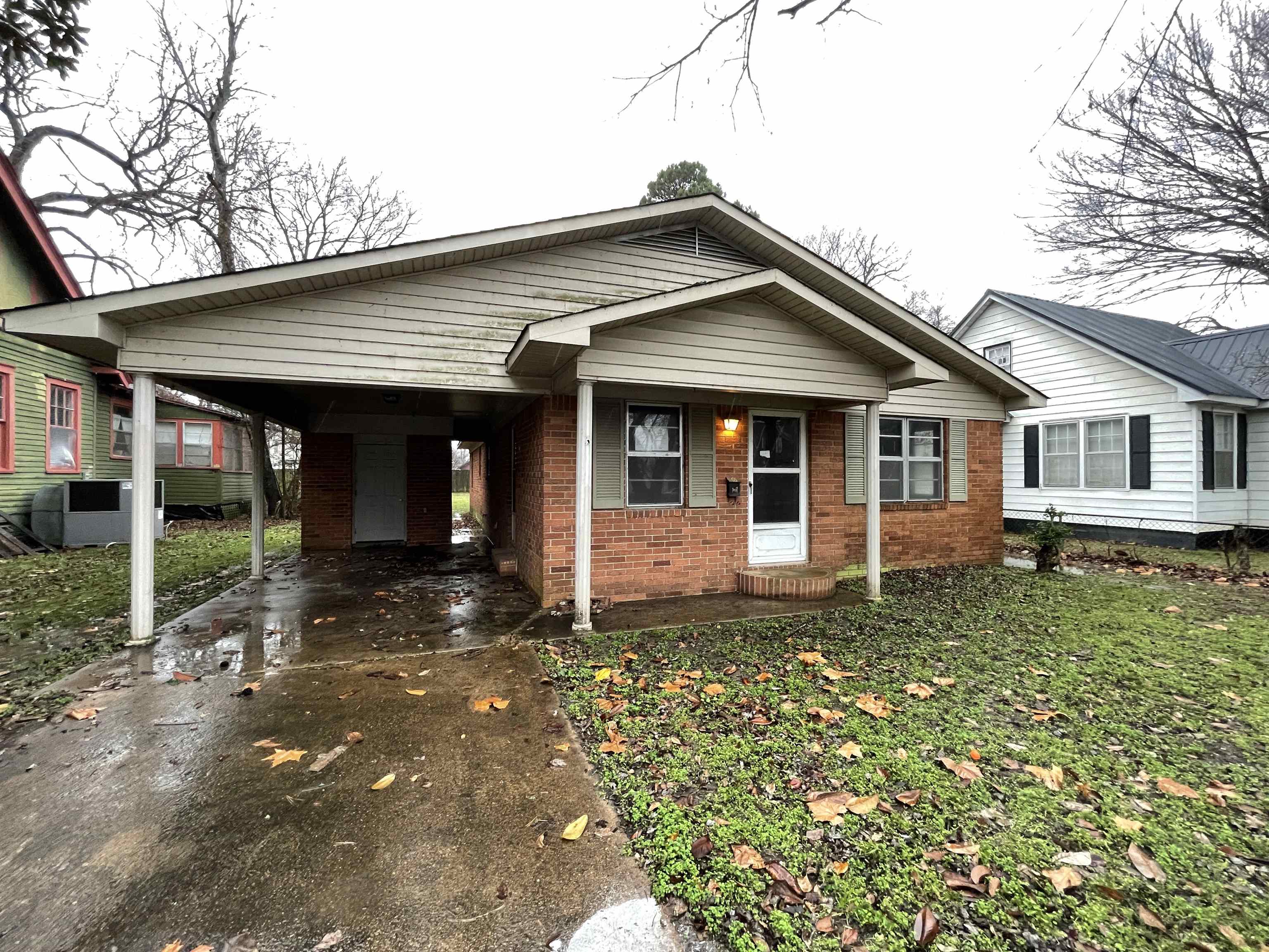 Cute, sturdy brick house near the high school. Three carpeted bedrooms. Outside storage and covered parking. Spacious living/dining combo. HUD-owned property Case #031-476048, it is sold "as is" and managed by Raine Companies. Seller will make no repairs. For information on how to buy and the timeline for submitting offers, go to HUDHomeStore.com.