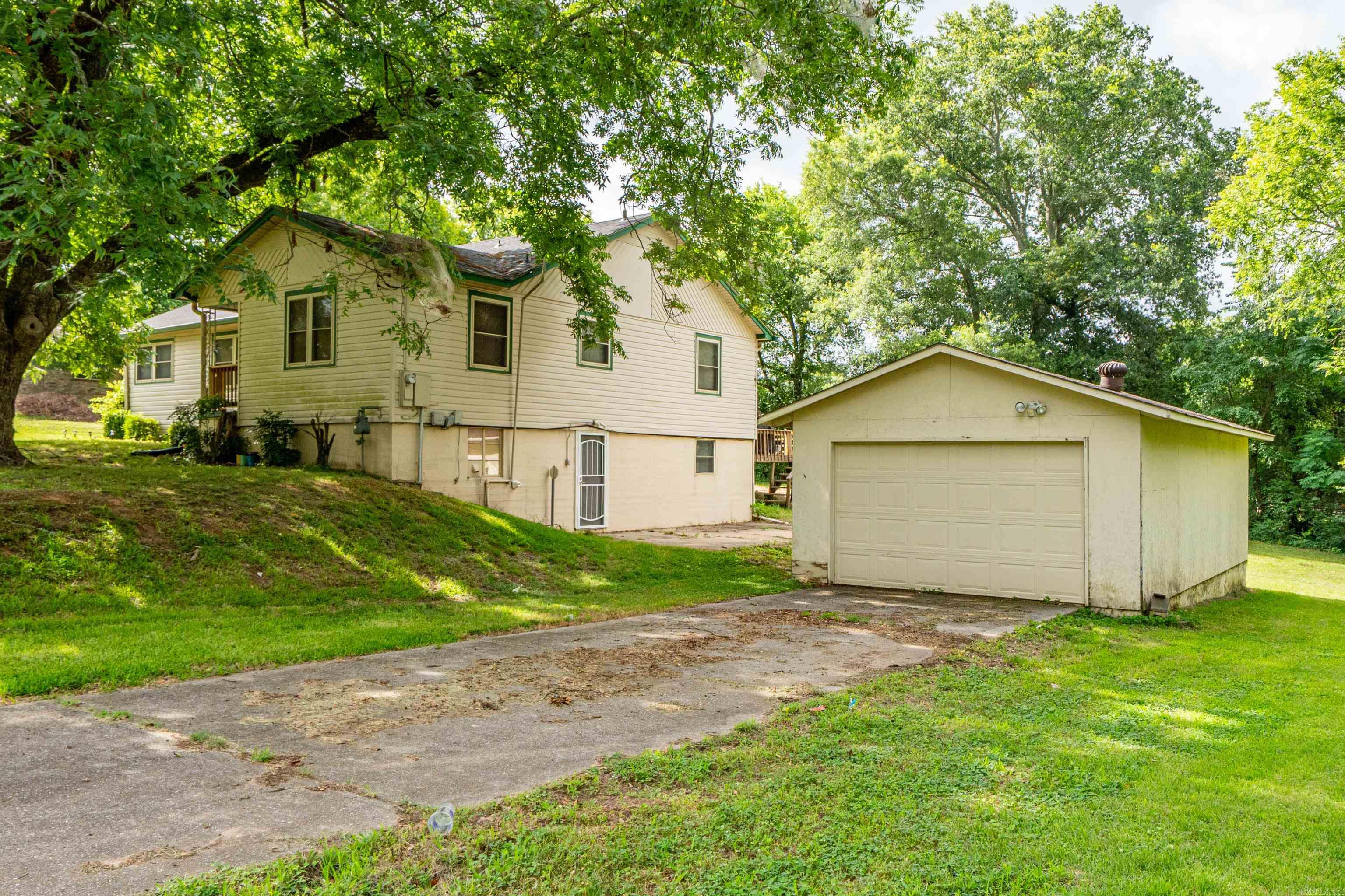 Don't miss this well maintained home situated on three oversized corner lots in the heart of Hot Springs! This home has 3 bedrooms, 1.5 bathrooms, a dedicated office, and a full basement. The inviting main level features comfortable living spaces filled with natural light, while the walk-out basement offers endless possibilities for a second living area, game room, home gym, or guest suite. Whether you're working from home or need extra room for hobbies, the additional office is a valuable bonus. Conveniently located just minutes from shopping, restaurants, parks, and all the attractions of Hot Springs, this property offers the perfect combination of character, space, and convenience. Roof Replaced in 2024. See Agent Remarks