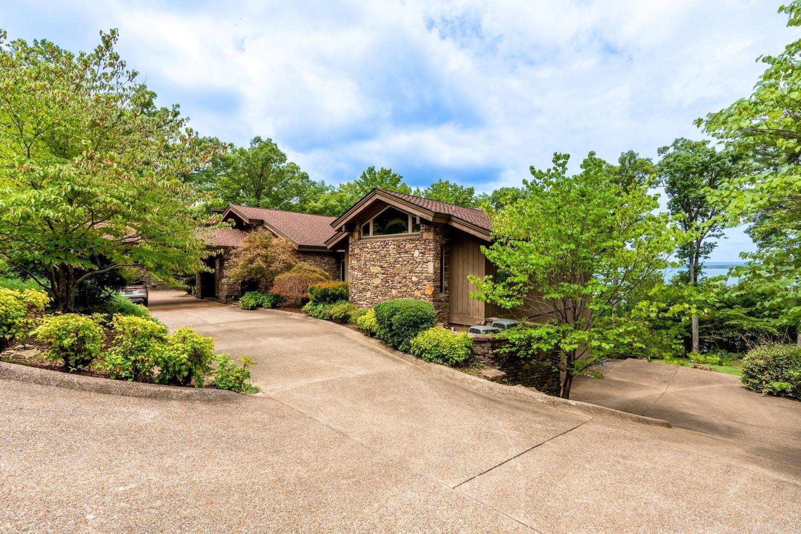 Eden Isle Lakefront home built in 2005!  This rustic contemporary beauty includes 4 bedrooms, 4.5 baths, 2 living areas, slate floors, granite tops, walls of glass and stone, custom wood finishes and some of the best lake views on Eden Isle!  Built by Dwyer Construction.
