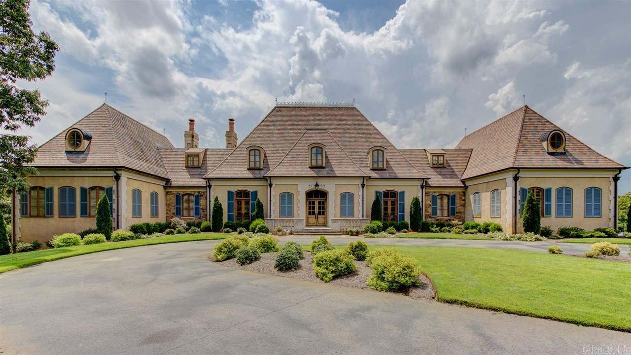 Magnificent & Luxurious French Country Estate-Panoramic vistas of mountains & lake. Entry, Dining Room, Gallery have natural limestone floors. Limestone counter tops in kitchen & baths. Climate controlled Wine Cellar & Wine Dining room.  Entertainment area & full kitchen lower level next to stone pool deck. Kitchen/Den see-thru Rumford FP. All doors & windows custom made. Master BR has private covered veranda w/stone deck, wood ceiling, cast stone railing. Slate roof w/copper flashing & copper roof drains.