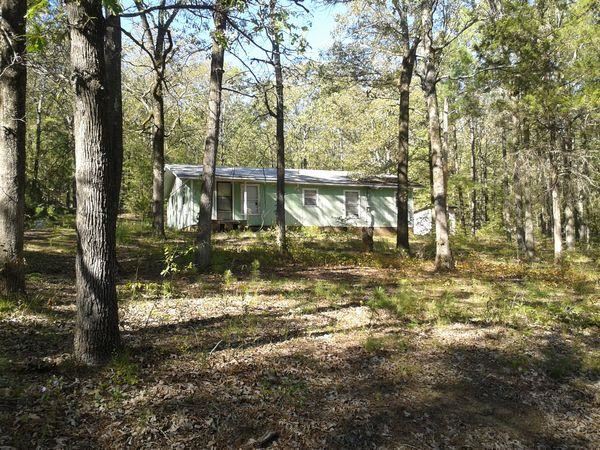 COUNTRY SETTING WITH A SMALL HOME. SOLD AS IS, NO REPAIRS, NO PROPERTY DISCLOSURE AVAILABLE