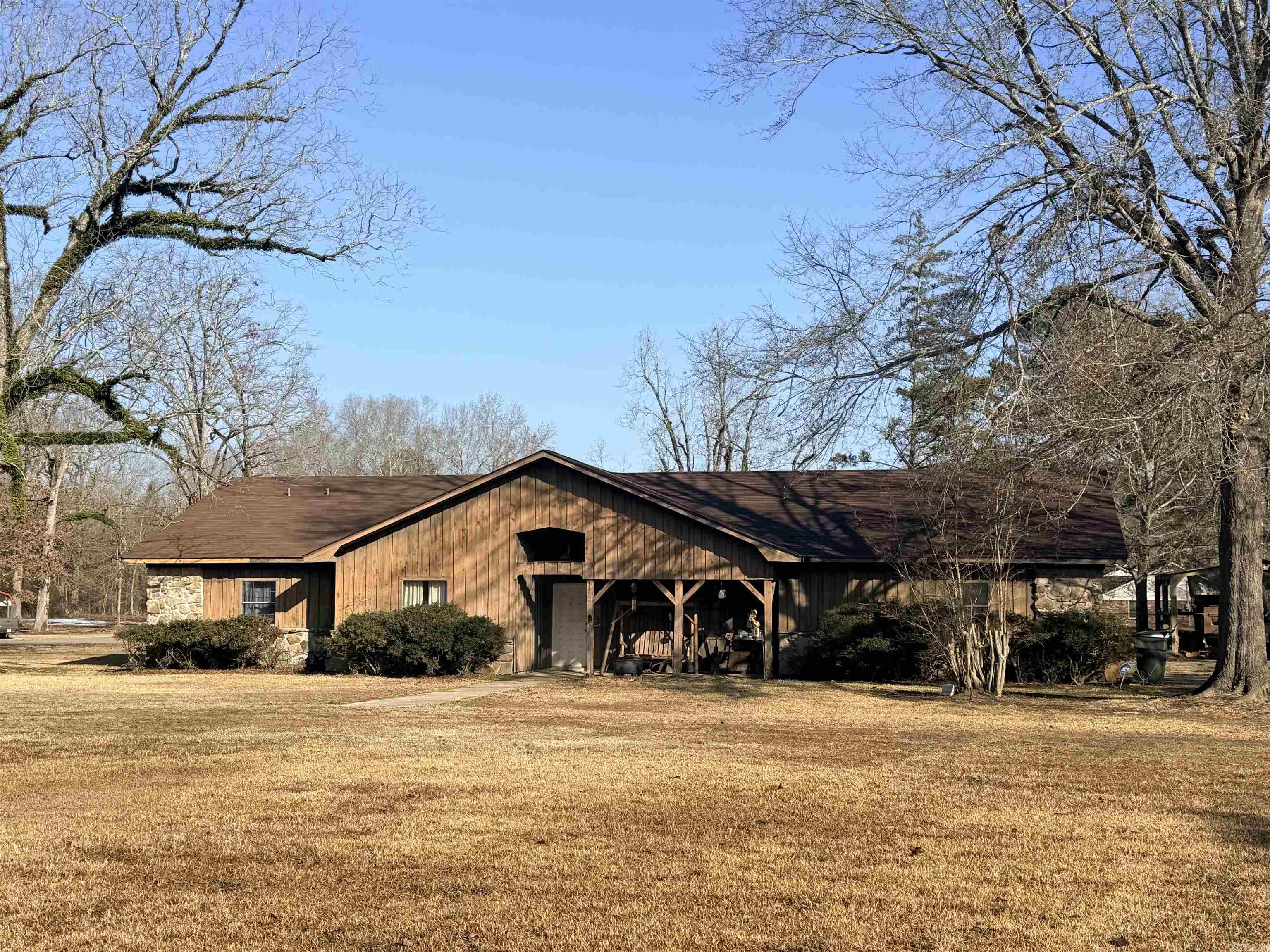 5 bedroom / 3 bath / 2,995 sqft ranch-style home on 1.38 acres. Features include a den w/beautiful stone fireplace, spacious game room with access to covered back patio, formal dining room, laundry room w/storage space, large kitchen with butler window to game room and 2021 stainless appliances. Stainless fridge will not convey. White fridge in laundry room will convey. Pool table and foosball table will convey. Lots of space and lots to offer. Perfect for a large family or someone looking to expand. Roof 2025; (2) gas hot water heaters 2020 & 2009; Central HVAC age unkown. (Central air is in process of being repaired.) **Seller will give $10,000 updating/flooring/painting/Closing Cost allowance with acceptable offer**