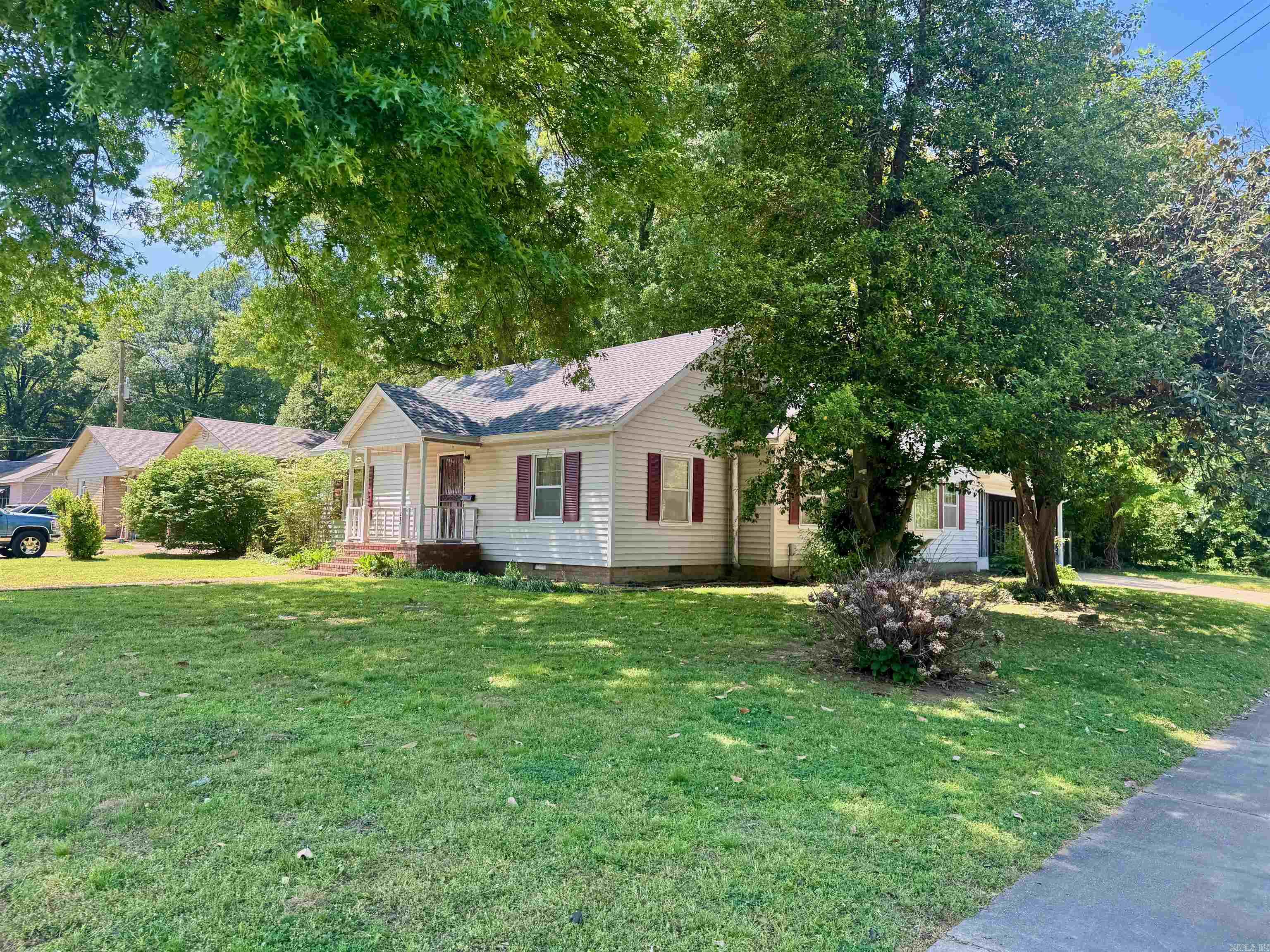 Tired of the cookie cutter new construction homes? This home has character & curb appeal all wrapped up in a nice layout. There are 2 living areas, 2 bedrooms, & a bath on the main & a 3rd bed & bath upstairs with loads of closet space. You will love the cozy deck off the breakfast area. There is also room for either a formal dining room, office. or playroom off of the kitchen. The backyard is fenced and has a metal outbuilding.