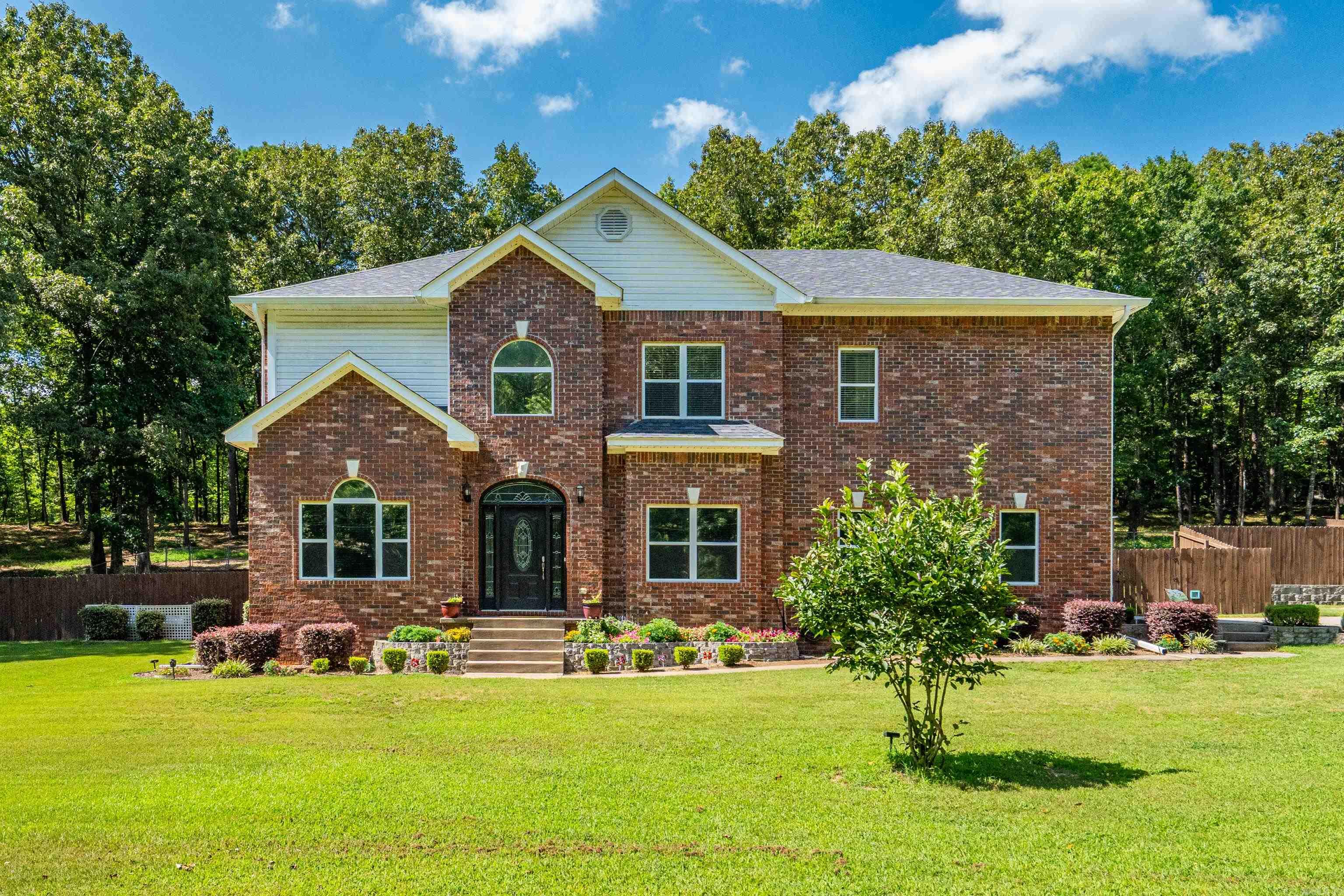 Welcome to this spacious 4-bedroom, 2.5-bath home situated on approximately 3± acres in Royal, Arkansas. Offering approximately 3,151± square feet of living space, this property combines generous indoor living with exceptional outdoor amenities. The thoughtfully designed floor plan provides ample space for everyday living and entertaining. Step outside to enjoy the in-ground swimming pool, beautifully maintained landscaping, and a fenced backyard. A detached shop offers abundant storage and workspace for equipment, hobbies, or recreational vehicles. Surrounded by open space while remaining just a short drive from area amenities, this property offers the opportunity to enjoy both comfort and functionality. Schedule your private showing today! Agents see remarks.