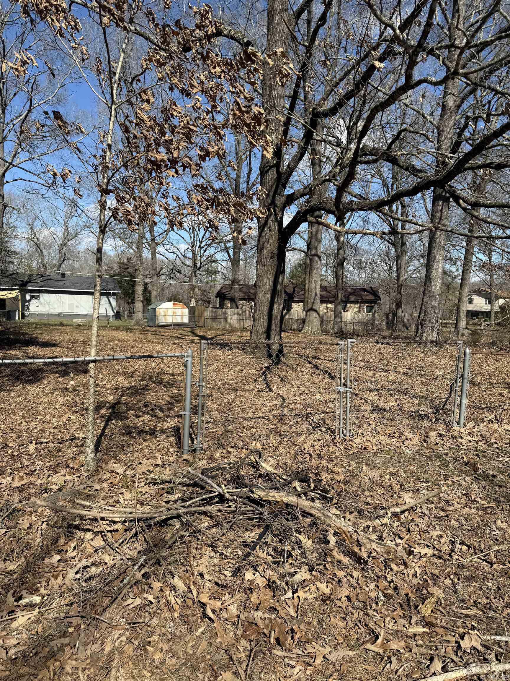 Great building spot that is already fenced and has a few mature trees!  No Mobiles allowed.