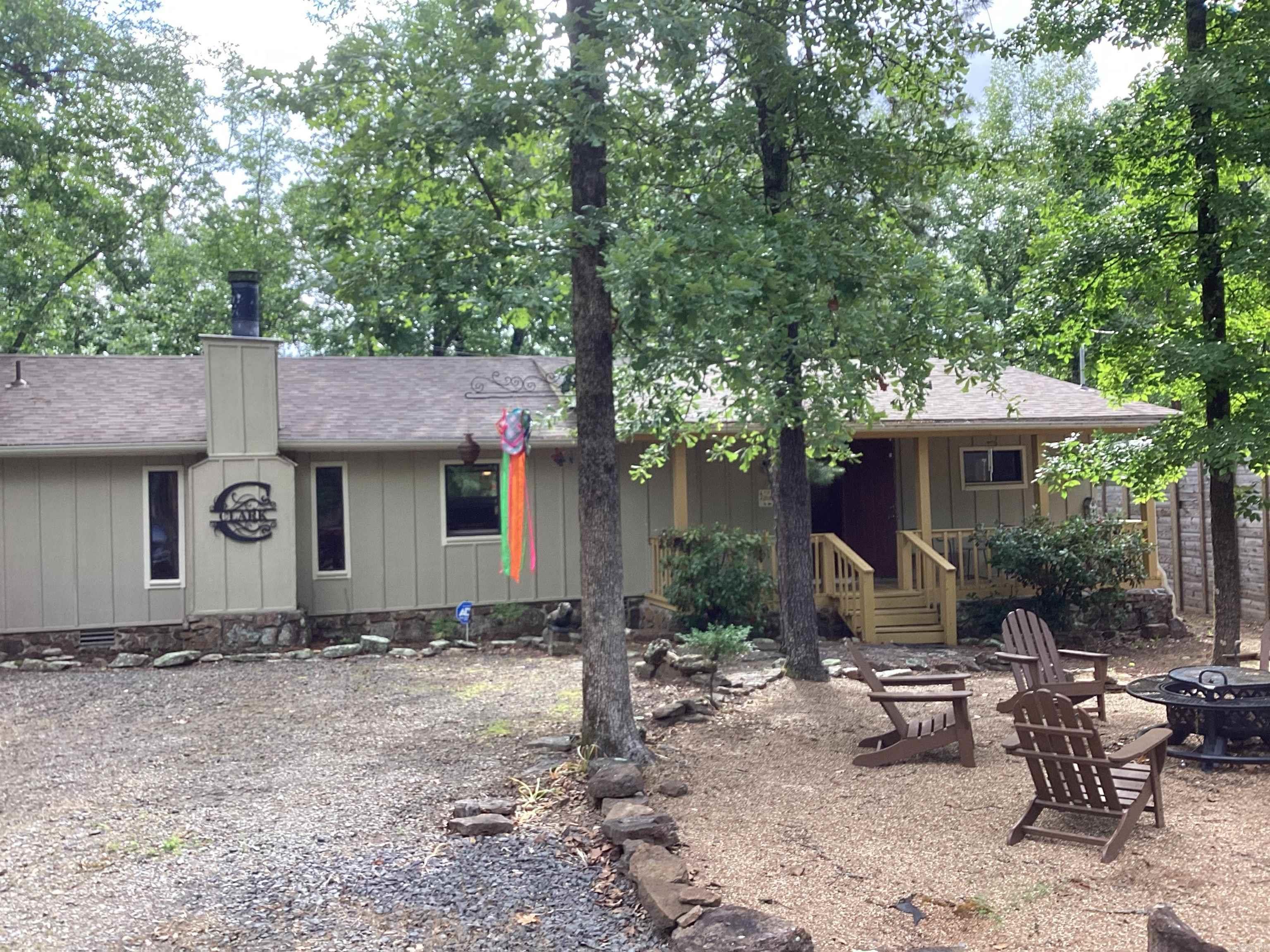 Well-maintained rustic lakefront home featuring board and batten siding and a natural stone exterior.  Enjoy stunning lake views, an excellent white line, and a gentle walk to the water.  Conveniently located within walking distance of Lacey's Narrows Marina, this home offers a beautiful natural stone fireplace and a detached 16 x 24 garage. A spacious sunroom overlooks the lake, while hardwood floors run throughout the home.  The property includes three bedrooms, two full baths, and a large living area perfect for relaxing or entertaining. Most all furniture will convey.