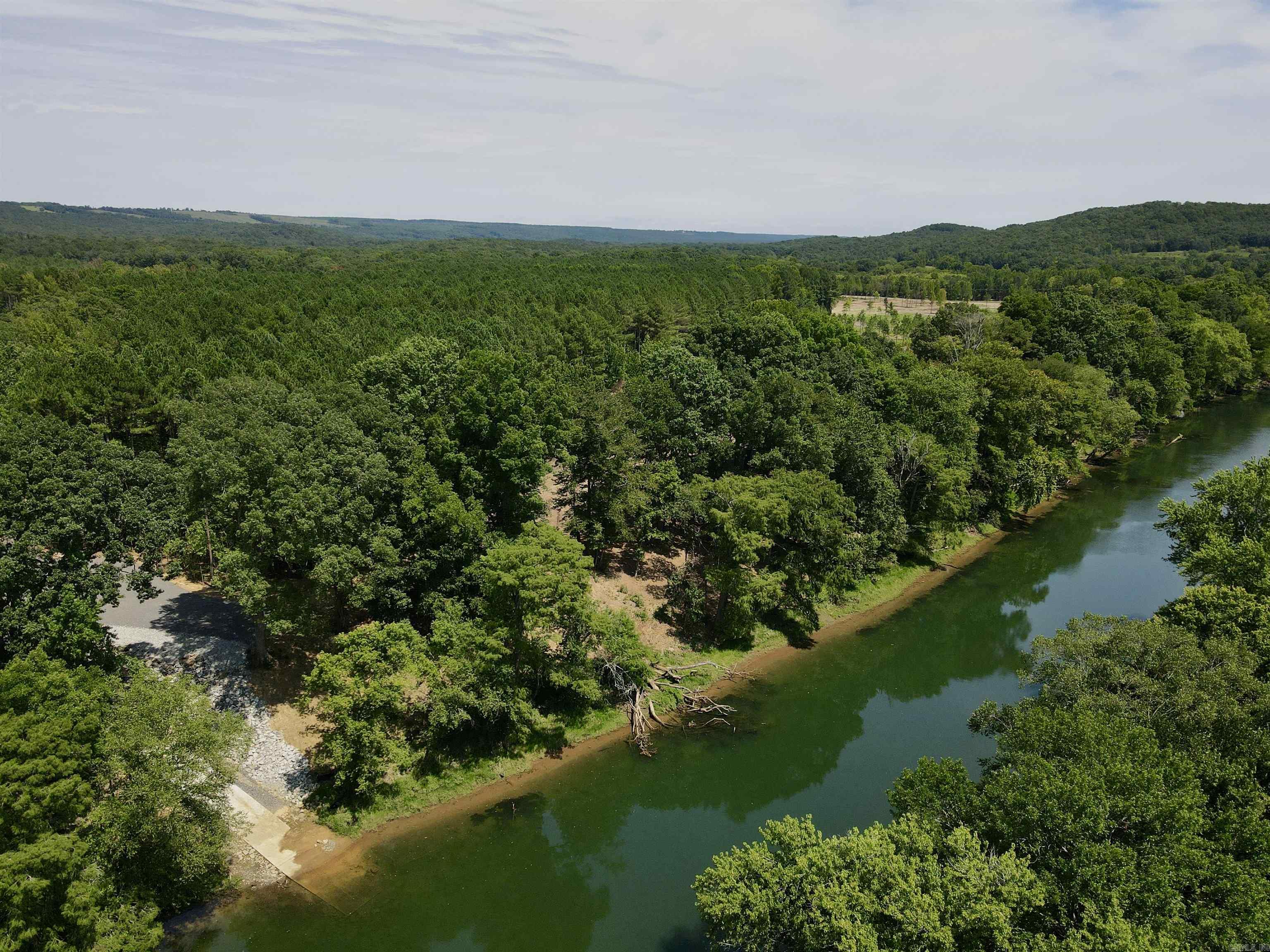 Lot #27 in The Pines on The Little Red. Affordable lot in a beautiful setting with private boat launch access!  Located just north of Pangburn and just south of Heber Springs, this is a perfect, affordable location for rural living. Access to a private, gated boat launch that's 3.2 miles upriver from Ramsey's Access, and 2.6 miles downriver from Dripping Springs Access. Don't overlook the small parcel size for opportunities to view wildlife too. There is an abundance of wildlife on this property.  If you're looking for privacy and the tranquility of the outdoors, this property is well suited for you. A mature pine buffer on the north, and tucked away off of a county road, this property is a peaceful getaway.   Conveniently located just outside of Pangburn, and minutes from Heber Springs, this property is in an outstanding location. The country life with the amenities of town just a few miles down the road.  The Dam Site Boat Launch on Greers Ferry Lake is just 15 miles to the north.