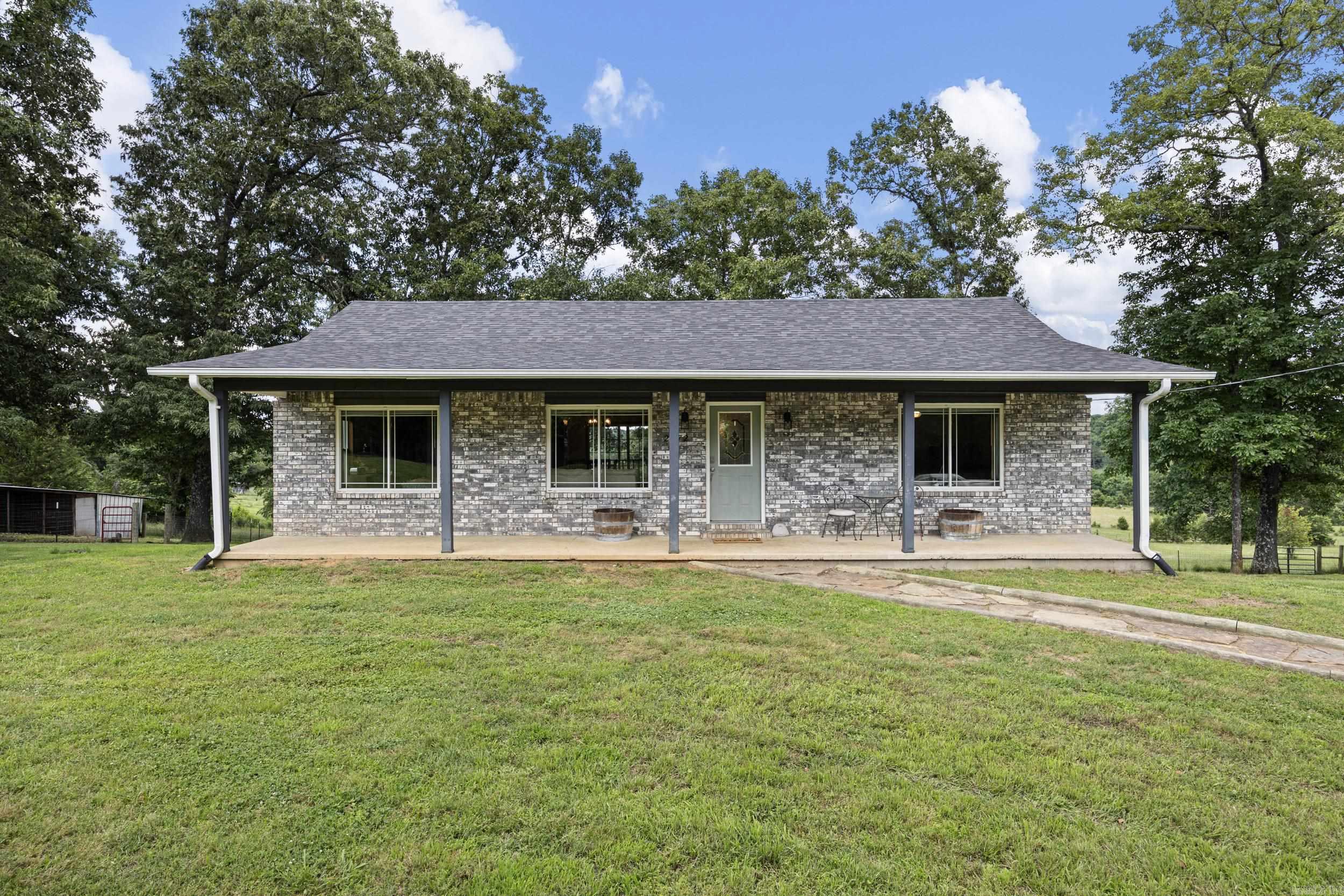 Escape to country living with this beautifully remodeled hobby farm on 15 acres! This spacious 2576 sq ft home features 4 bedrooms, 2 living areas, and 3 baths with updates throughout, including gorgeous granite counter tops and modern finishes. Enjoy peaceful mornings and stunning panoramic views from every angle. The property also includes a 24x30 shop and several other out buildings, perfect for hobbies, storage or equipment. Conveniently located just 8 minutes from Sugar Loaf Marina on Greers Ferry Lake, offering easy access to boating, fishing, and recreation. A rare opportunity with endless amenities and room to enjoy the outdoors. Property is fenced and cross fenced.