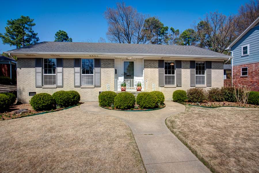 Wonderful, one level brick home w) 3 bedrooms & 2 full bathrooms in the heart of Midtown Little Rock! Many updates  throughout w) original hardwood floors! Entry opens into the great room, followed by the dining room & kitchen. Kitchen has breakfast table area & enters to a laundry room. Hearth room off the kitchen w) wood burning fireplace. Parking in the rear w) attached carport for 2 cars. Large, beautiful, private backyard w) wooden fence & a covered patio area for outdoor entertaining. Don't miss this!