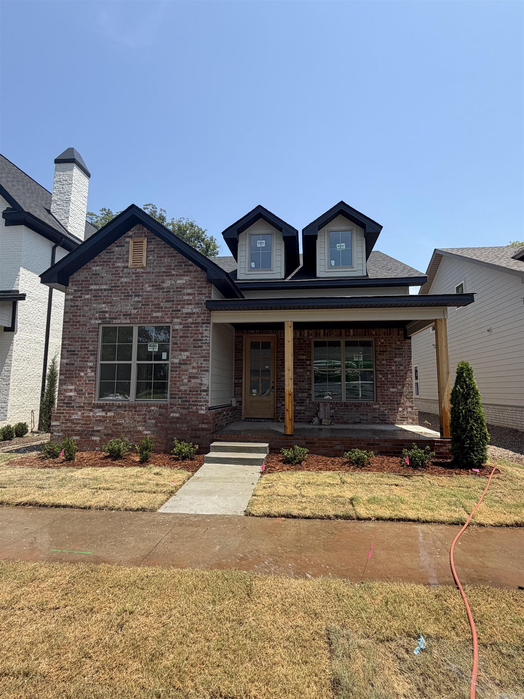 Welcome to 424 Gardens Lane in North Little Rock! This beautifully designed new construction home offers 2,290± SF of heated and cooled living space and 3,060± SF under roof, featuring 4 bedrooms, 3 full baths, and an oversized 2-car garage with a bonus play area or workshop.  The open floor plan showcases custom cabinetry, solid surface countertops, stainless steel appliances, a gas cooktop, built-in wall oven, built-in microwave, pantry cabinets, and a spacious living area with a vented gas log fireplace. The private primary suite features a luxurious tiled walk-in shower and quality finishes throughout.  Built for comfort and efficiency, this home includes foam insulation in the exterior walls, a high-efficiency HVAC system with fresh-air intake ventilation, and upgraded energy-saving features designed to provide year-round comfort and lower utility costs.  Conveniently located near shopping, dining, schools, and major highways, this home offers the perfect combination of quality craftsmanship, modern amenities, and exceptional value. Schedule your private showing today!