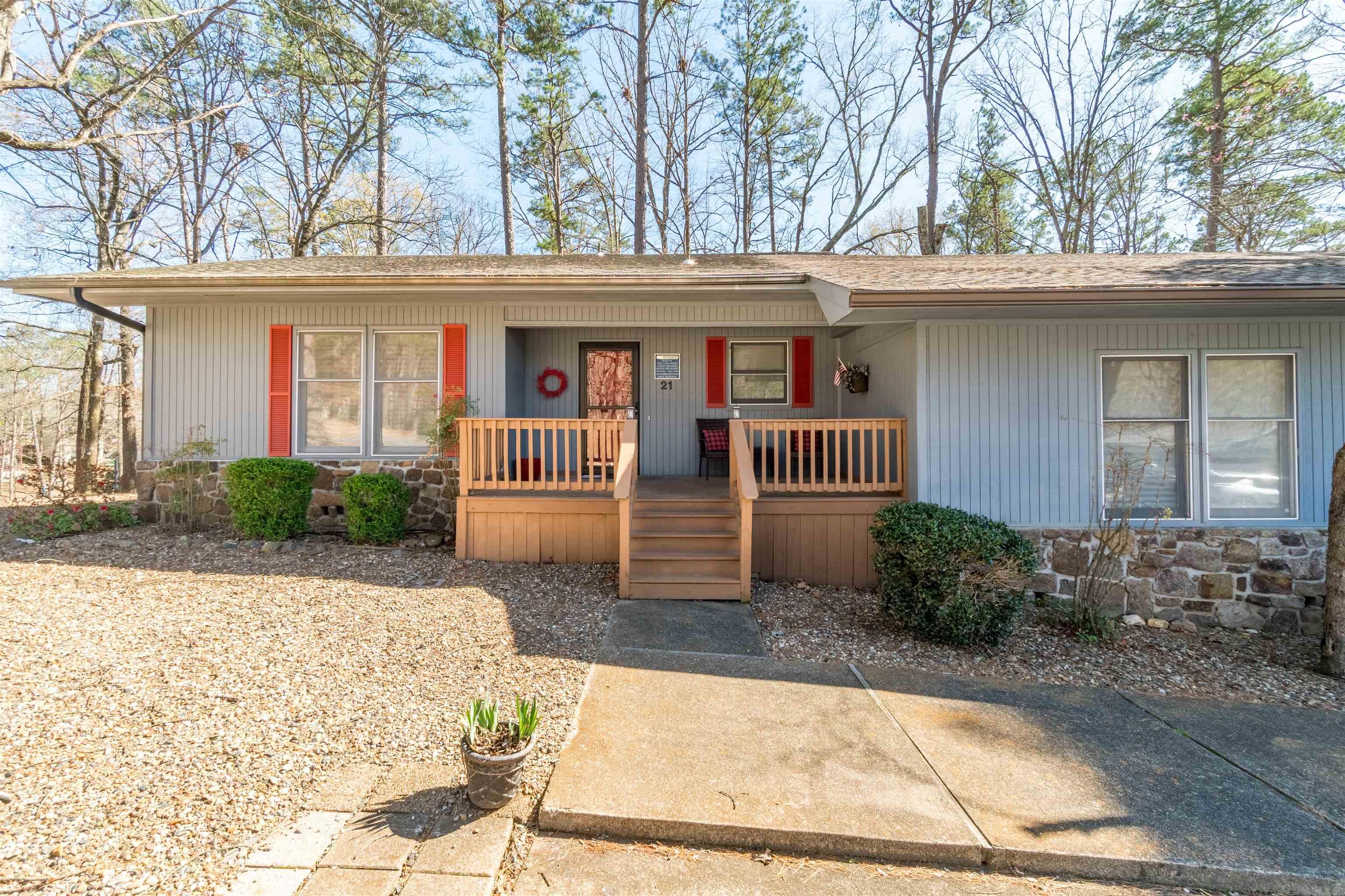 Enjoy beautiful Lake DeSoto views from the spacious deck of this charming 2 bed, 2 bath one-level townhome in Hot Springs Village. Offered fully furnished, this home is ready for immediate enjoyment as a primary residence, weekend getaway, or potential investment opportunity. The open floor plan creates a comfortable flow between the living area and kitchen. Both bedrooms feature double closets, and additional storage is available in the pantry, linen closet, and under the deck. The home has been updated with granite-top bathroom vanities, upgraded flooring throughout and a new roof (to be installed 4/6-4/10)! Located on the West Gate / Garland County side in the Jessieville School District with easy access to lakes, golf, trails, and all the amenities Hot Springs Village has to offer. Don’t miss the chance to own a move-in ready lakeview property in this sought-after community.