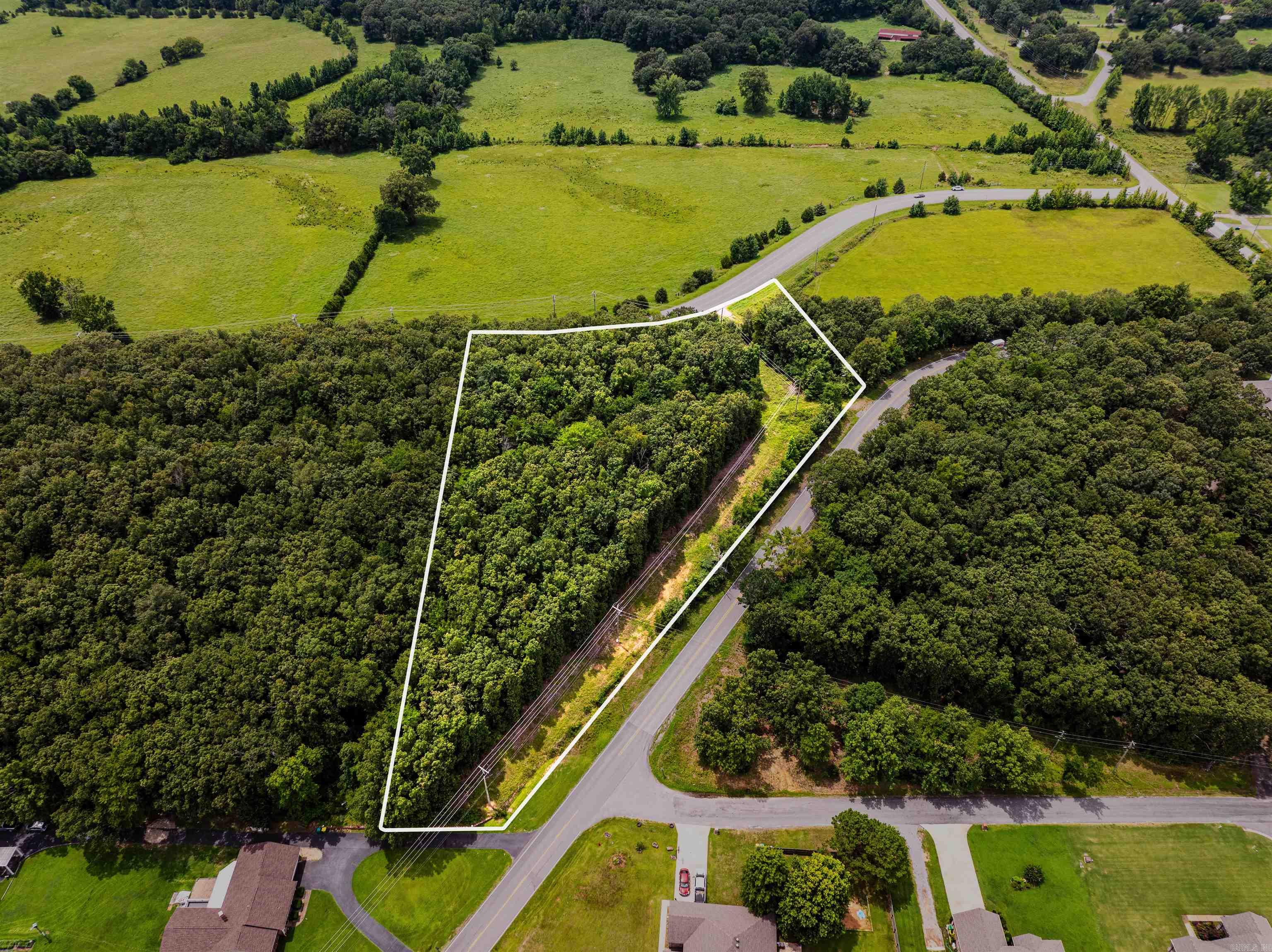 Escape the hustle and bustle without giving up convenience. This is Lot Three of Seven premium tracts of land we are offering, each three acres more or less with a blend of open fields and serene wooded areas-perfect settings for your dream home!  *Beautiful Building Sites  *Utilities Already in Place  *Percolation Tests Completed  These tracts are ready for you to build the lifestyle you've been envisioning. Don't miss the chance to secure your piece of peaceful living just minutes from the city