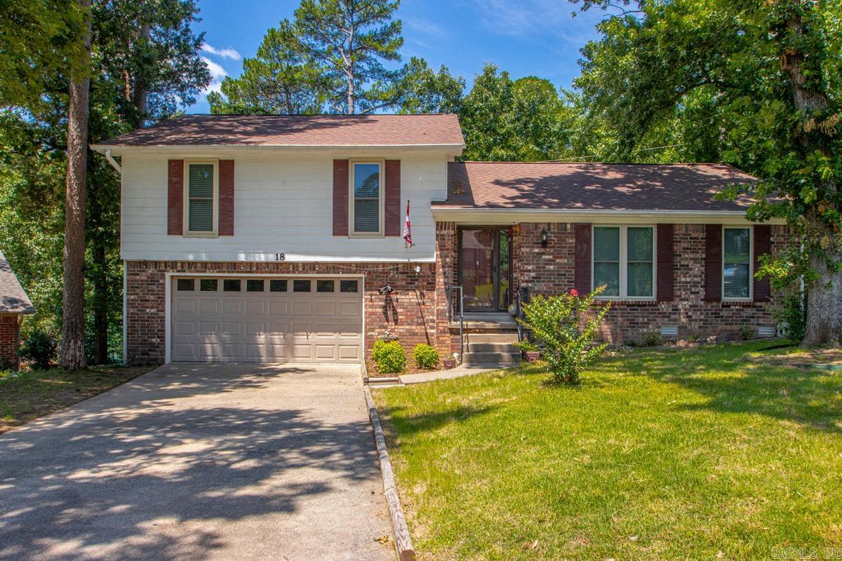 Situated on a cul-de-sac in West Little Rock, this 4-bedroom, 3.5-bath home offers over 2,500 square feet with multiple living areas, generous storage, and unique features including a sauna and hot tub room. The spacious deck provides a great space for relaxing or entertaining, while the fireplace with gas starter adds warmth and charm. The fourth bedroom functions well as an in-law suite, offering added flexibility for guests or multi-generational living. Major updates include replacement windows and a roof installed in 2018. Ready for cosmetic updates, this home presents an excellent opportunity to add your own style and value.
