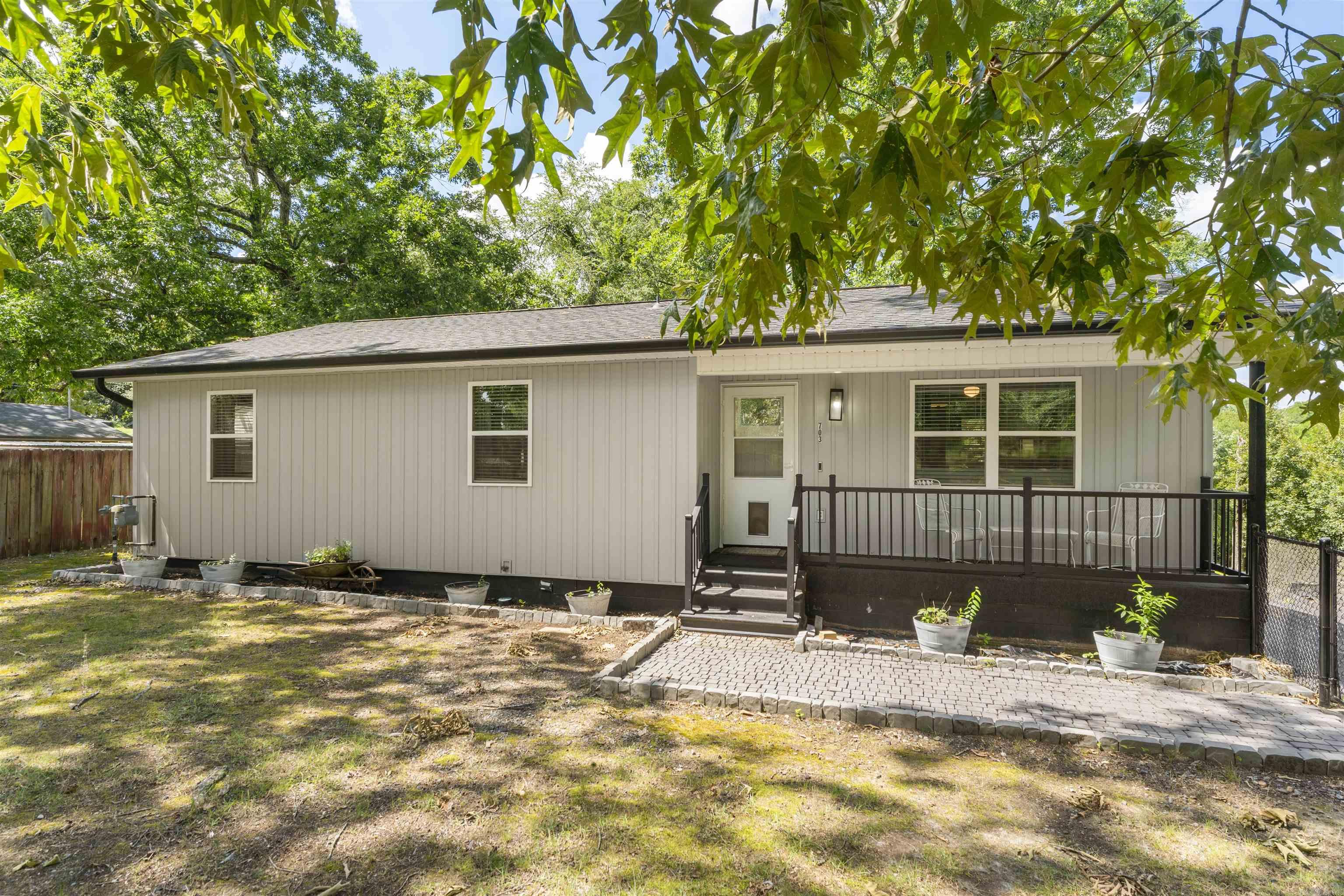 Welcome to 703 Euclid Street in Hot Springs! Move right into this beautifully updated 3-bedroom, 2-bath home offering over 1,200 square feet of comfortable living space! Nearly everything has been updated, giving you the peace of mind and modern finishes today's buyers are looking for. Major improvements include a roof that's less than 2 years old, an HVAC system and hot water heater that are both less than a year old, plus new siding, windows, fascia, and a brand-new back deck. This charming home offers comfortable living in an established neighborhood with convenient access to shopping, dining, schools, medical facilities, and all that Hot Springs has to offer. Don't miss out on the proximity to Oaklawn! Inside, you'll find a functional floor plan with spacious living areas, abundant natural light, and a welcoming atmosphere. The property provides a great opportunity for first-time homebuyers, those looking to downsize, or investors seeking a solid addition to their portfolio. The yard offers space for outdoor enjoyment, gardening, or entertaining. Whether you're searching for a primary residence or an investment property, this home is ready for its next owner.