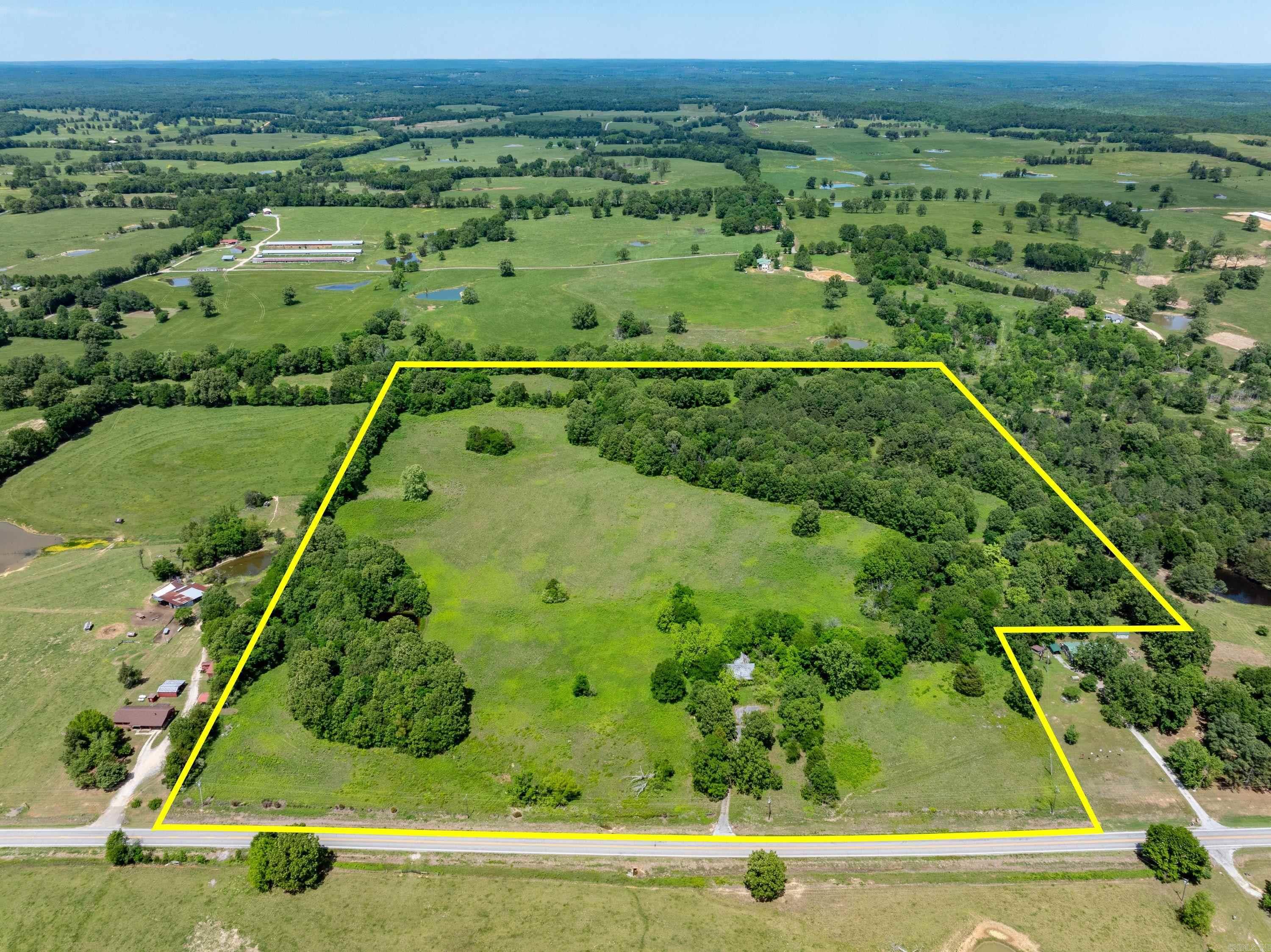 46 +/- Acres | Hwy 58 Frontage | Pond | Utilities | Prime Farm & Hunting Land Near Cave City, AR  This 46 +/- acre tract in Sharp County (Sidney, AR) is a rare opportunity to own a versatile piece of Arkansas land with endless potential. Conveniently located just outside Cave City, this property features Highway 58 frontage, offering excellent access, visibility, and future development possibilities.  The land is a beautiful mix of open pasture and scattered mature timber, making it ideal for cattle, horses, hay production, or a private homestead. A pond on the property adds both functionality and scenic appeal, perfect for livestock or recreation.  Utilities are already in place with county water and electric on site, saving time and expense for future improvements. An older home is present and is being sold at no value, giving you a clean slate to build, develop, or renovate if desired.  For outdoor enthusiasts, this property delivers excellent hunting opportunities with strong potential for white-tailed deer, turkey, quail, and small game—a true recreational and hunting property in North Arkansas.