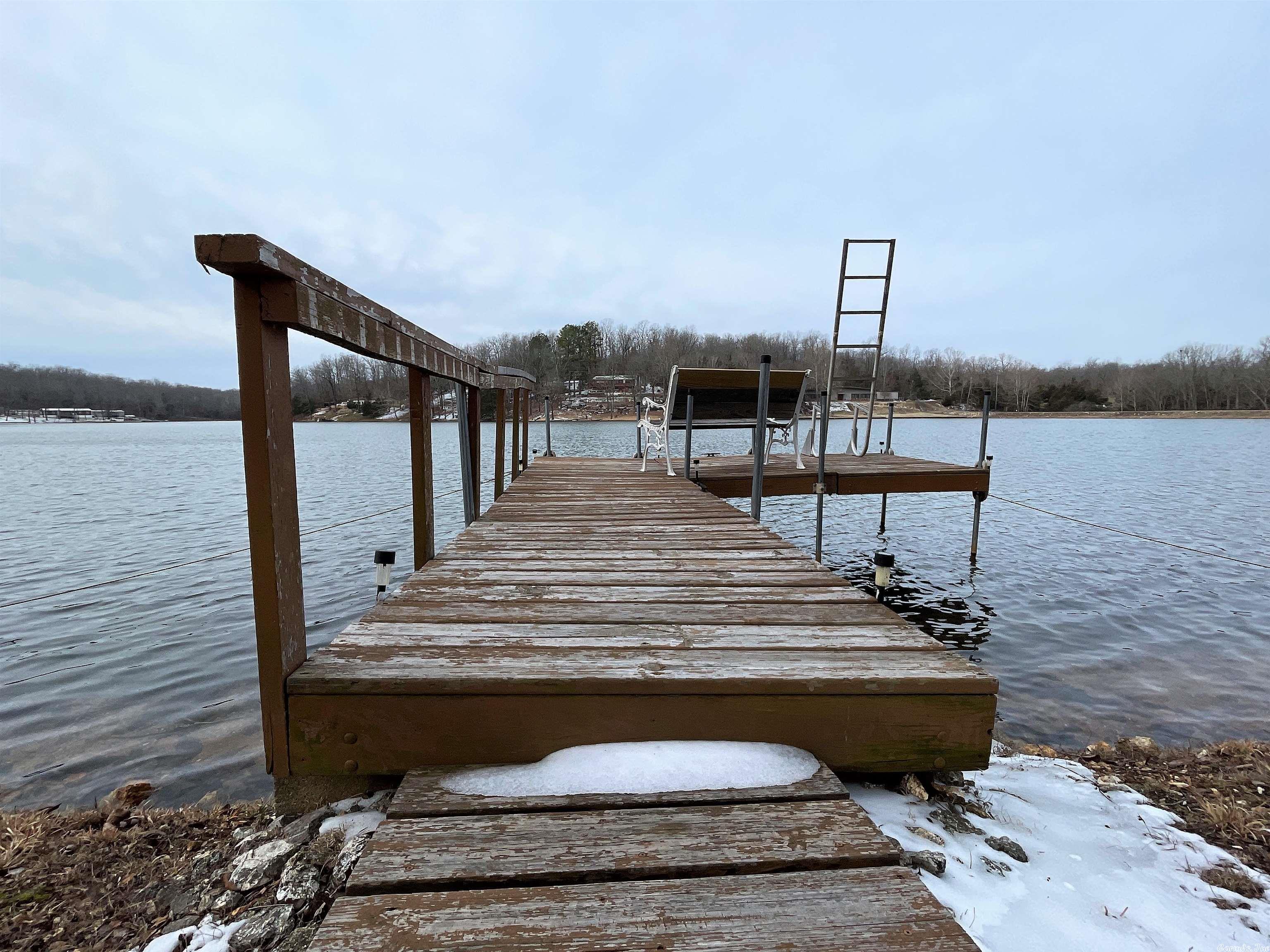 !!!Amazing OPPORTUNITY for lake front home in the Spring River Area!!!  So cute! Clean and maintained vintage mobile home with some nice upgrades on Lake Mirandy complete with working vintage kitchen, swim dock,  firepit and outside storage for all the toys!  Year round beauty, mature trees, even birds and other fun critters to watch from the porch!  You can even take a very short walk to the community park and boat launch. Come on and put your hat in the ring!