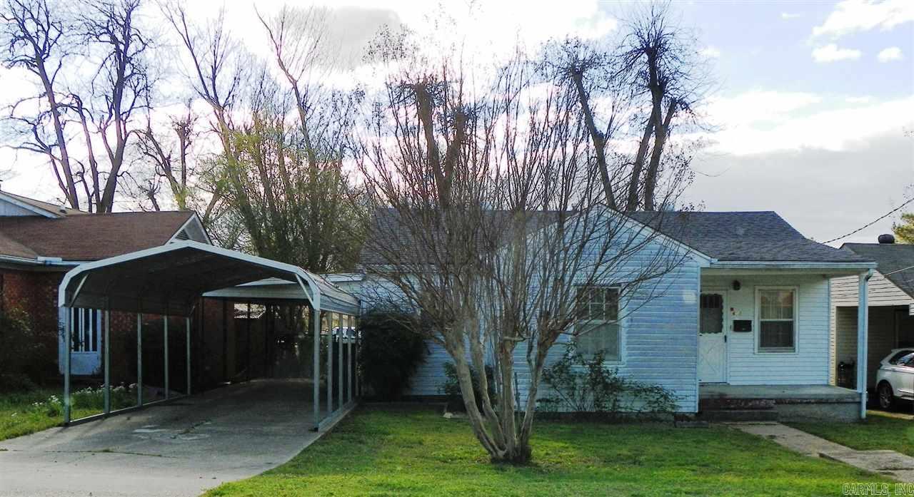 Great starter home or investment property! Take a look at this well maintained home with some updates,  an extra large fenced back yard & 2 storage buildings. Hardwood flooring in living, dining, and bedrooms. Tile in kitchen and bath. All appliances remain including refrigerator, washer and dryer. Roof approx. 3 years old.  SEE AGENT REMARKS