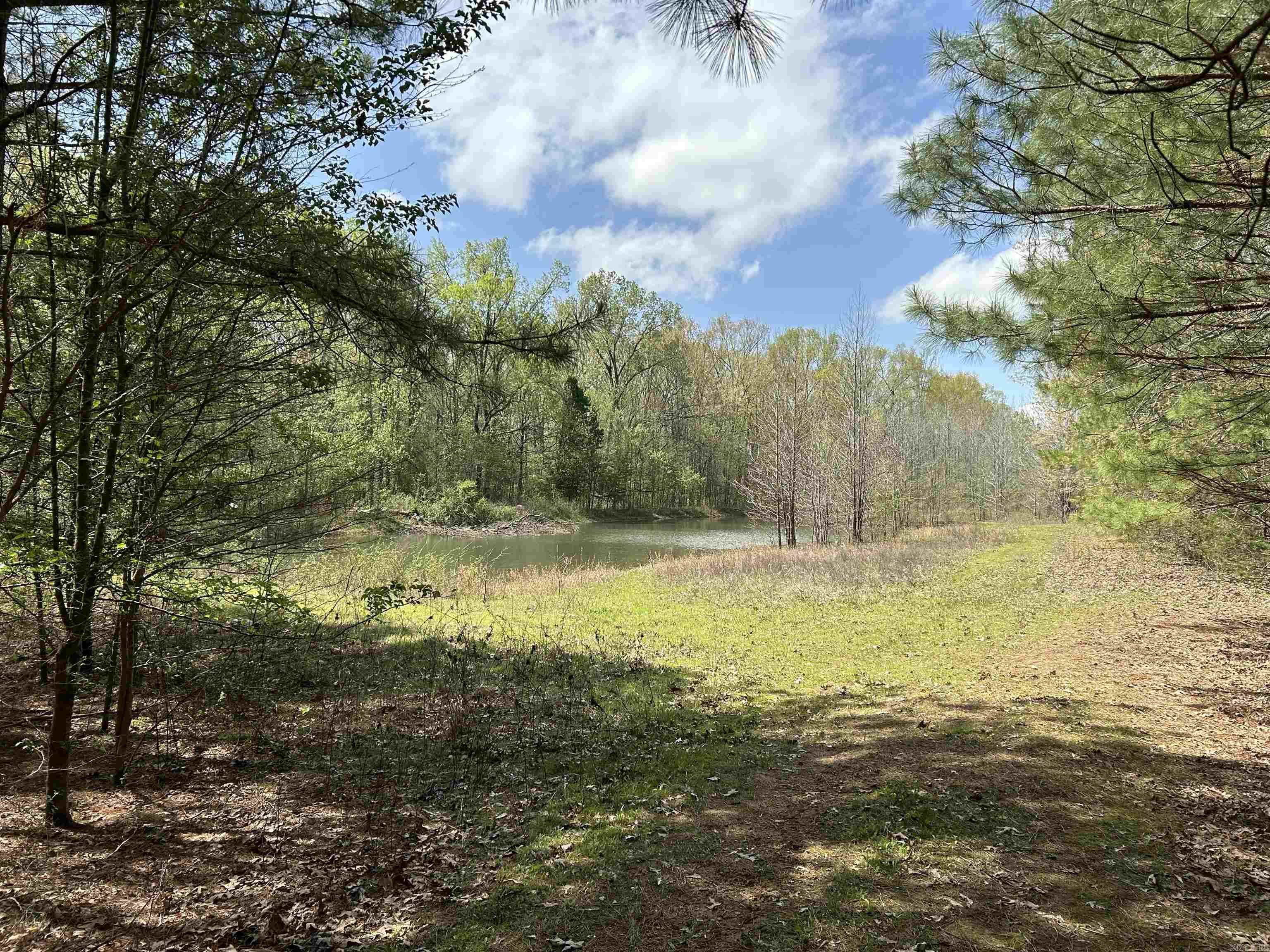 19.88 +/- acres located just outside Vilonia, Arkansas.  Paved road access to the property entrance gate, approximately 660' +/- of paved road frontage.  Electricity on the property, 4.1 acres +/- of pine timber, 15.78 +/- acres of hardwood timber. Dirt road/trail access through the property (suggest ATV/UTV). Property is 19.88 +/- acres existing in two parcels which form a larger rectangle. Excellent building site for those who want the relaxed atmosphere of country living with a short commute to the city.