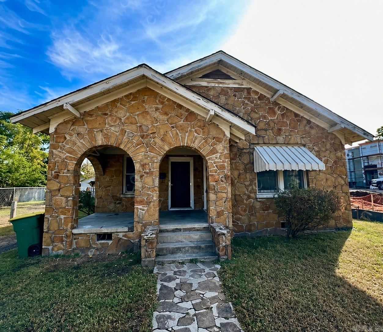 This 5-bedroom, 2-bath home offers approximately 1,562 square feet of living space and strong income potential. Previously renovated around 6 years ago, the property has been tenant-occupied since that time, providing a consistent rental history and immediate investment appeal. With a functional layout and generous bedroom count, this property is well-suited for maximizing rental income, with market rents estimated around $1,300/month. The exterior features a unique stone façade and covered front porch that adds character and curb appeal. Please note: Interior photos reflect the condition at the time of renovation and may not represent the current condition after extended tenant occupancy. Whether you’re looking to expand your rental portfolio or secure a value-add opportunity, this property presents solid upside with the right vision.