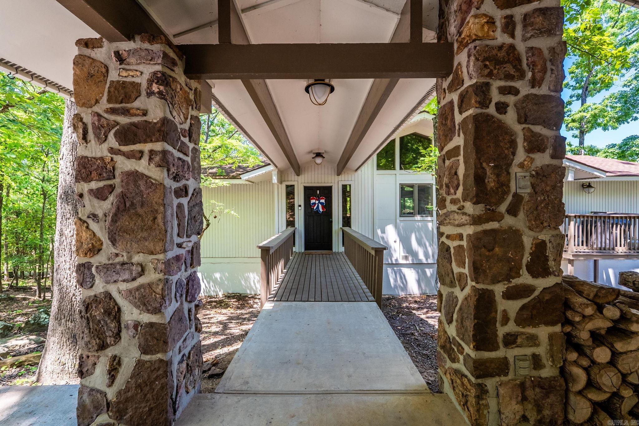 EDEN ISLE LAKEFRONT & REMODELED on GREERS FERRY LAKE This 4 bedroom, 4 bathroom home has 2 living areas and is located just down the hill from Red Apple.  Designed by Architect Frank McGary and recently updated with thoughtful updates, this is a tasteful blend of Eden Isle originality with modern interior finishes.  It's an easy walk to the water to enjoy the sunset over Diamond Bluff or a short cart ride up to Red Apple.  Take-in a day of Golf and Tennis or lounge by the pool. Keep your boat nearby at Eden Isle Marina for a day on the water.  This is more than a home, it's a lifestyle!