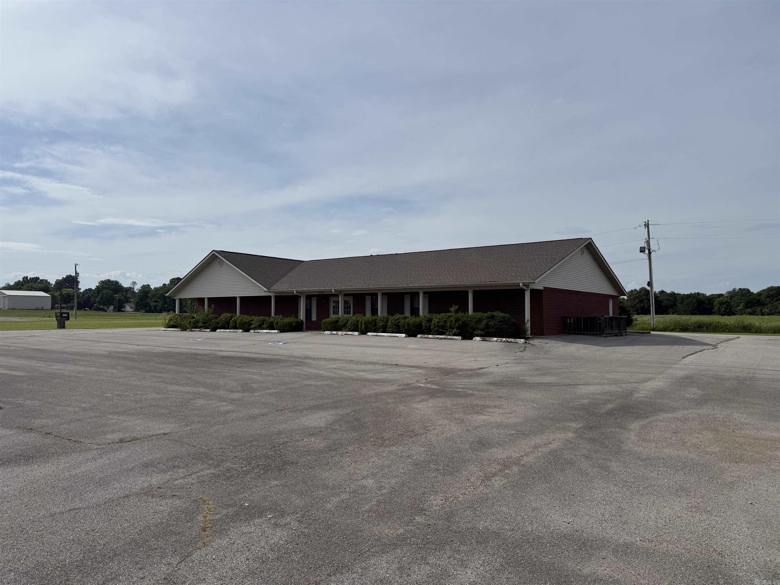 AUCTION!! Commercial opportunity located along Highway 49 North in Marmaduke, Arkansas. This 4,320 sq. ft. building sits on approximately 2 acres and offers excellent highway frontage, convenient access, and a large paved parking area. The building was previously operated as a funeral home and includes multiple rooms, office/reception areas, a large meeting/chapel space, and flexible interior layout that could be adapted for a variety of commercial or professional uses. Potential uses may include office space, medical or counseling office, event space, nonprofit use, training center, or other commercial operation. Property is subject to a deed restriction prohibiting future use as a funeral home. Buyer should verify zoning, utilities, permitted uses, restrictions, acreage, and building size. Online only auction. Auction ends August 25 at 6:00 PM. See agent remarks for bidding information.