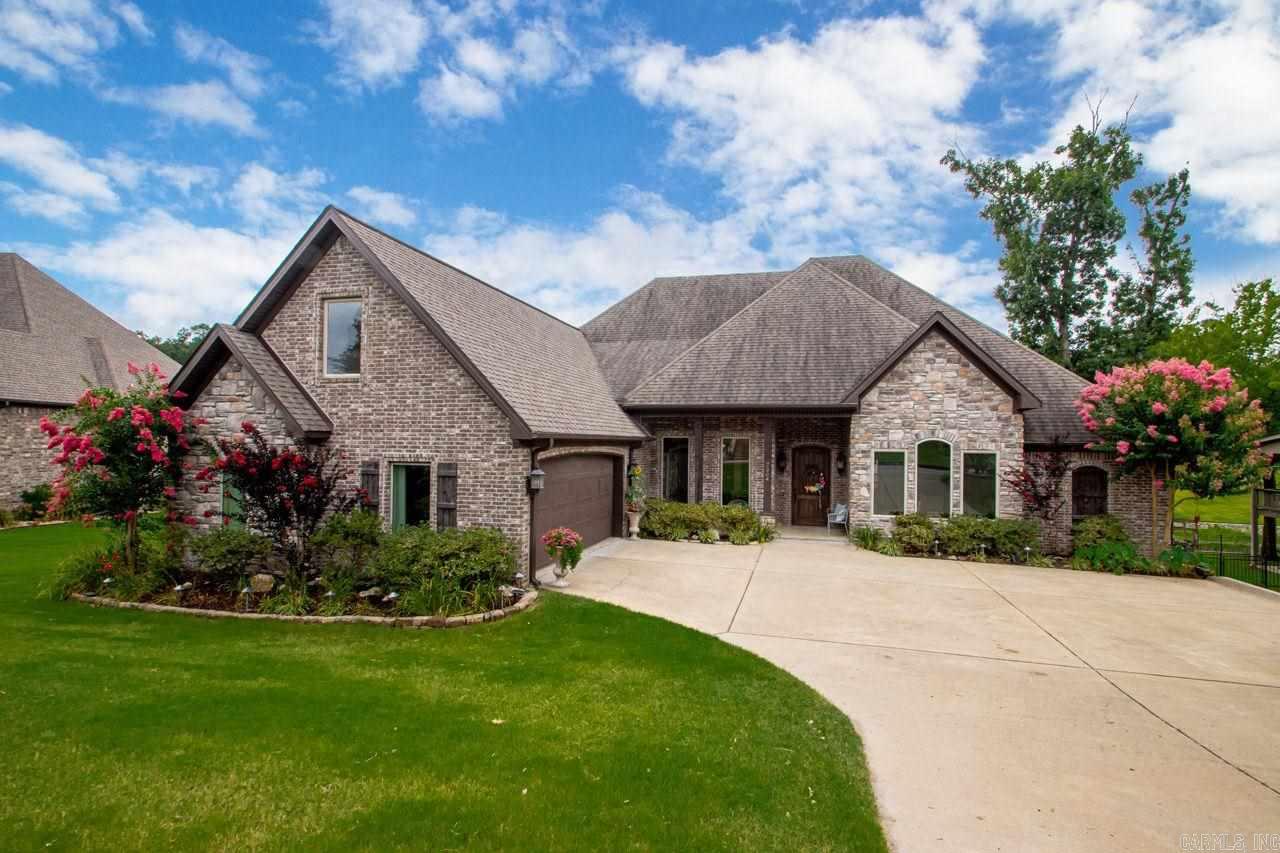 This custom waterfront beauty lives like a one level, in the coveted Palm Beach private circle of Hurricane Lake. Every room in the house boasts a generous size with ample storage and custom built-ins throughout. You will love the extensive granite counters throughout the chefs kitchen with views of the lake from every angle. There is a hearth room off the kitchen in addition to a formal living room downstairs, and an oversized bonus room upstairs (could be 5th BR). Huge deck and boat dock to enjoy sunsets.