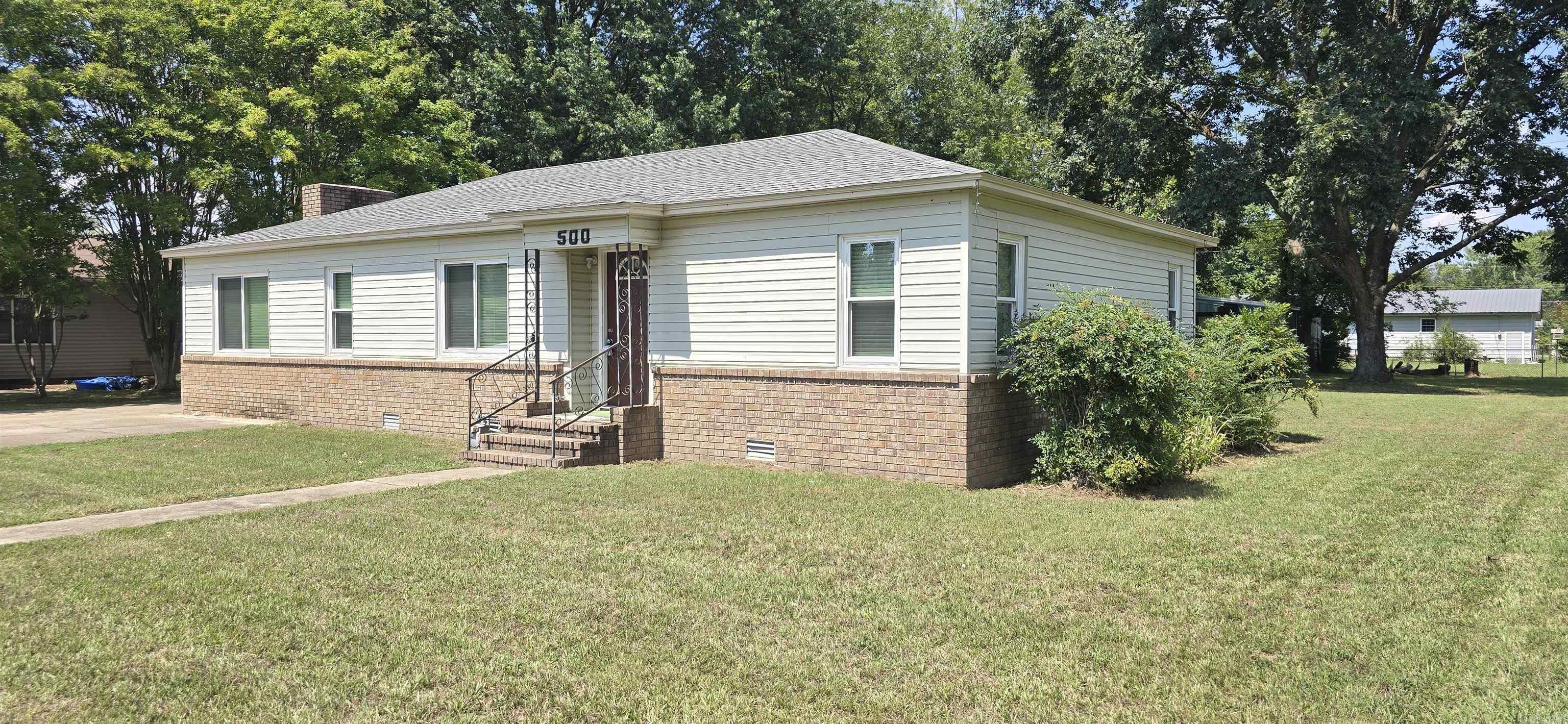 Spacious 4 Bedroom 2 bath on huge corner lot. Completely updated. Luxury Vinyl Plank floors throughout. Granite Countertops. Stainless Steel Kitchen appliances. Storage building or Office Space with window unit. Fireplace.