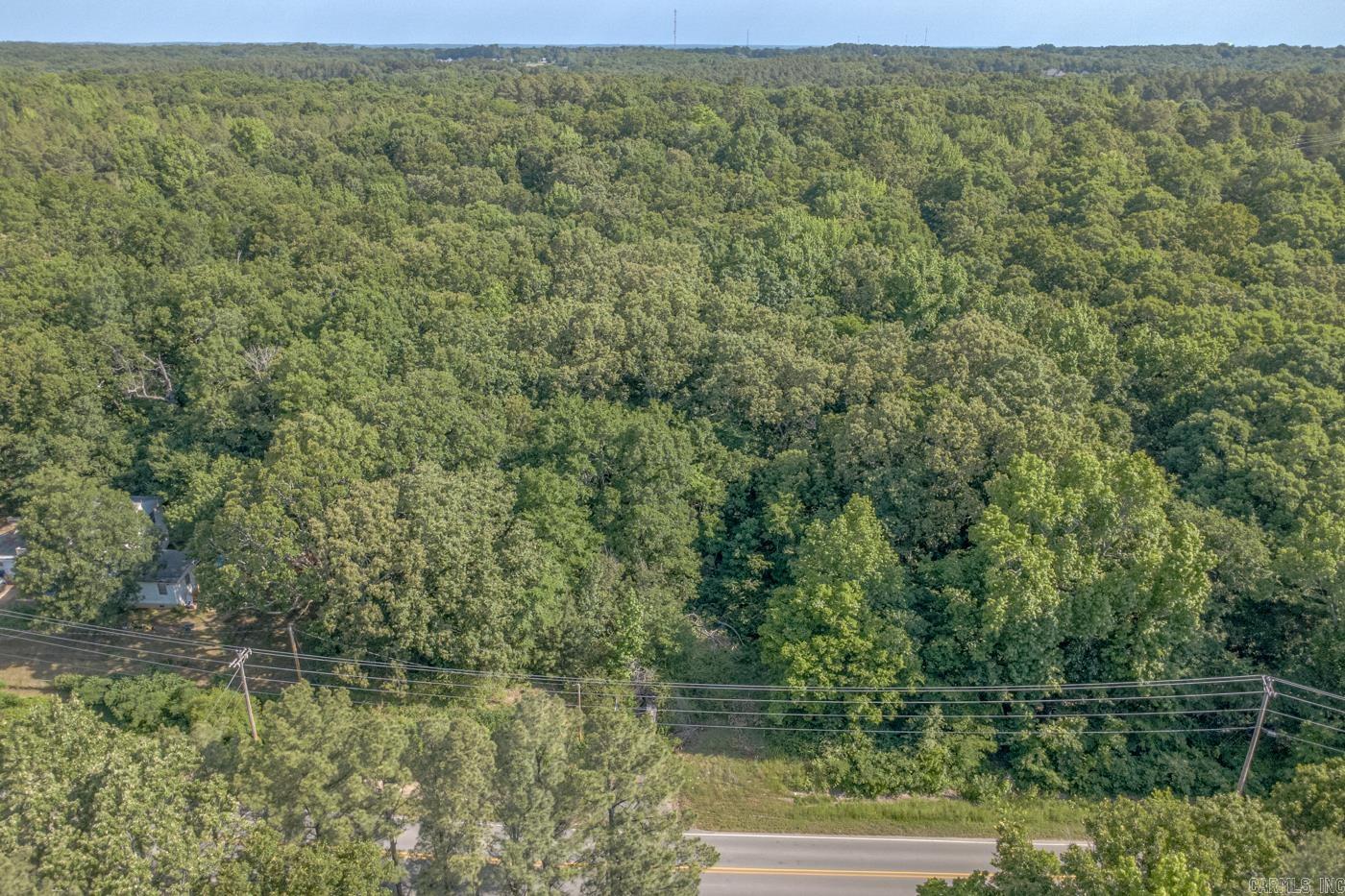 Welcome to Market 2608 Flemon Rd in Jonesboro, AR within the Valley View School District. Situated on 2 wooded lots totaling approximately 0.54 +/- acres and measuring approximately 180 x 100 is an opportunity to secure a future homesite or investment property. The property features gently sloping terrain w/ mature hardwoods, paved road frontage, existing drive access, and utilities available. The property is zoned R-1 and surrounded by established homes and wooded scenery. Conveniently located w/ easy access to Hwy 49 S, I-555, and favorite local amenities. Whether you’re looking to build now or invest for the future, this property offers flexibility and long-term potential within the Jonesboro market. Call today to schedule your tour and make an investment in tomorrow.