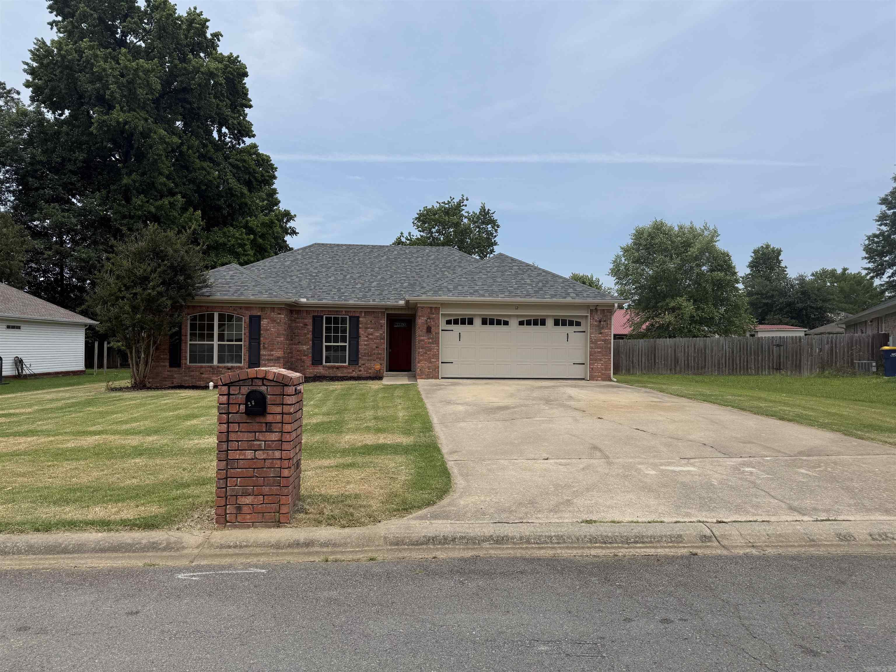 This adorable home is move in ready and waiting for you to make it yours! Features include a split floor plan, a great room with fireplace and boxed ceiling, large master bedroom with 2 closets and spacious master bath!  New luxury vinyl plank throughout and  fresh paint in 2025!  Roof , siding and gutters were replaced in 2021.  Large fenced  yard with storage building is perfect for barbecues and family gatherings.  Schedule your showing today!