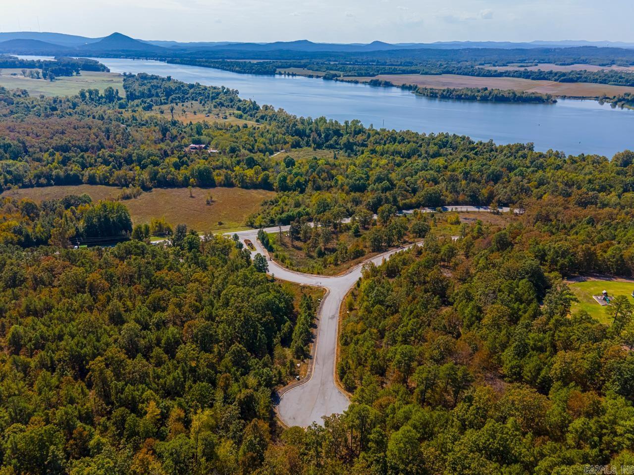 RIVER VIEW LOTS!! DREAM BIG!!! Because this just may be what you're dreaming of!! Two lots giving you more space and privacy with a River View and a view of Pinnacle Mt!  If you're working from home, I promise, you won't mind taking a break on your veranda, with a view of the Ar River, Pinnacle Mt, Chenal Towers and other Mountain Ranges! Minimum sq ft to build is 2500 sq ft. and comes with all underground utilities, to include water, electricity, gas and sewer.   Also ATT Fiber High Speed internet! Enjoyable evenings with Mango Sunsets!! What's not to love! Minutes to Maumelle! Gates are open 2-4 on Saturday and Sunday. Come on out! You're always welcome!