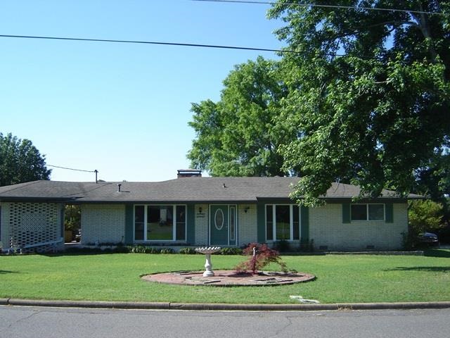 Immaculate updated home! Beautiful hardwood floors, new carpet, pocket doors in bathroom, tiled patio off the den for those relaxing afternoons and a private deck off your master suite. Additional 2 car garage in the back plus a separate storage building with electricity. The study could be used as a dining room or easily converted to a third bedroom. Great convenient location - close to hospital and shopping!