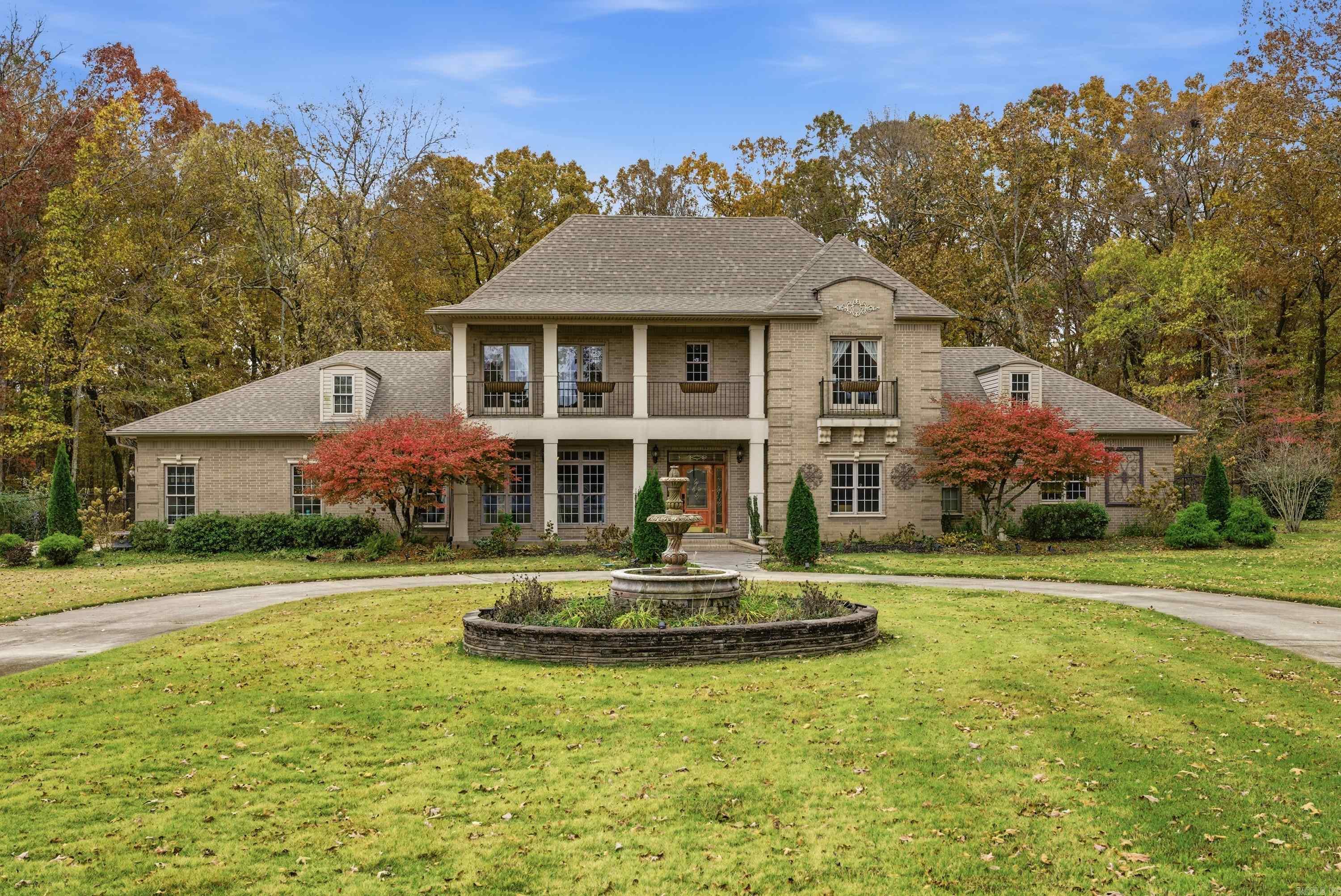 This home sits on 7.47 beautifully landscaped acres and welcomes you with a grand entrance and quality throughout. Real hardwood floors, crown molding, and spacious living areas flow seamlessly. The chef’s kitchen offers top-grain wood cabinets, an island with inset stovetop, warming tray, and a coffee buffet. The stunning primary suite features patio access, dual vanities, two walk-in closets, a large custom-tiled shower, and jetted tub. Upstairs are two guest bedrooms, each with its own bath, plus a large walk-in hobby room. Additional features include a gas fireplace, backup generator, two walk in lit/floored attic storage areas, and a fenced backyard. The 3-car garage has a rubber floor and an in-garage storm shelter. Outside includes a gated entrance, extensive landscaping with irrigation well, 50-amp RV hookup with dump site, and two steel-beam shops—40x50 with electricity, water, and bathroom, and 20x30 with electricity. Agents see remarks for showings.