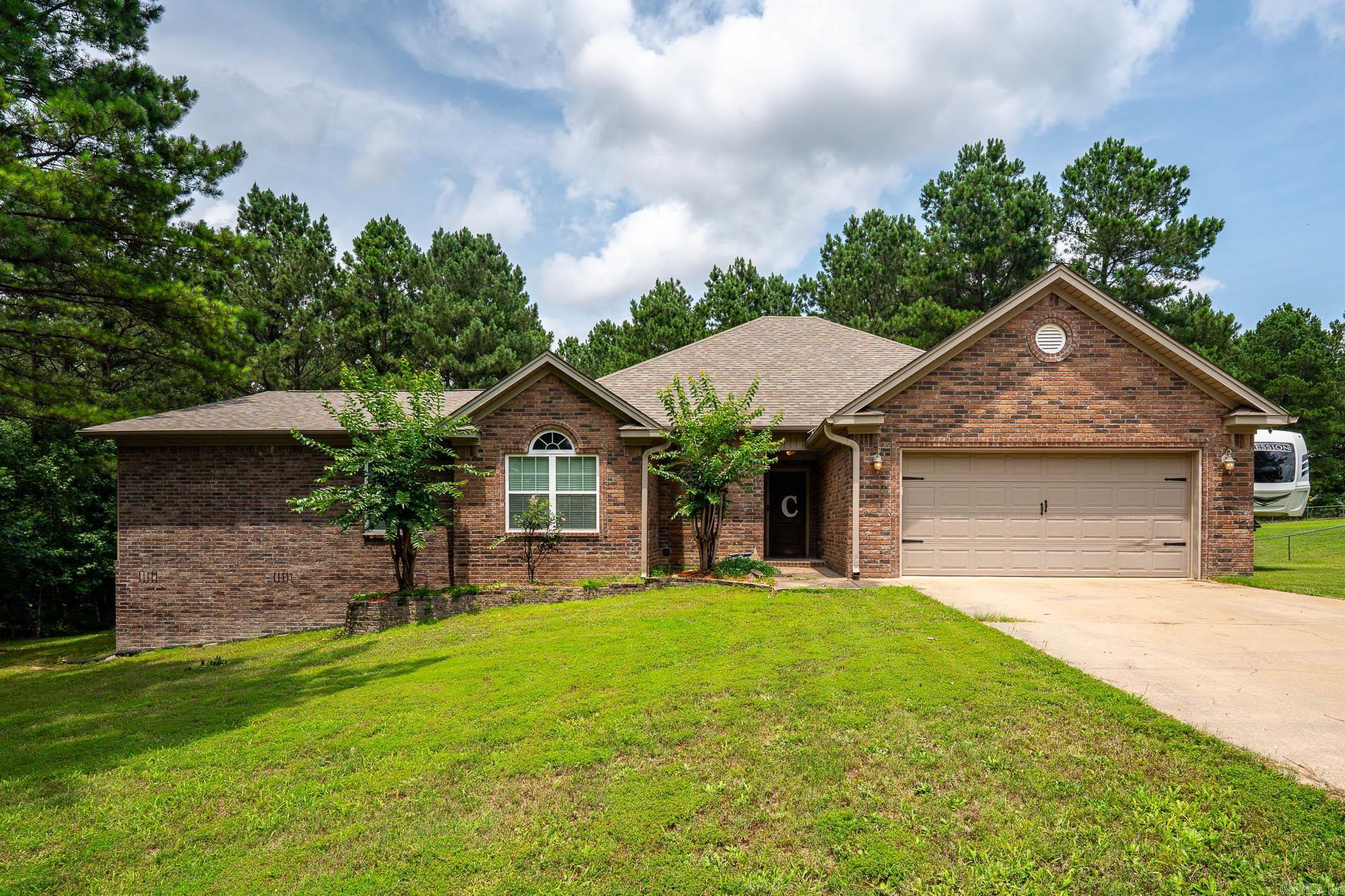 This one has it all! Acreage, bonus room, shop & HUGE covered deck! Welcome home to peaceful country living on 2 beautiful acres in Bauxite! Featuring countless thoughtful updates and design features, including 10-ft ceilings in the living room, wood-burning stove, a custom tray ceiling in the primary suite, and a spa-like bath with walk-in shower and jacuzzi tub. A professionally constructed addition delivers valuable extra living space, including a bonus room, additional bedroom area, and storage room, perfect for a growing family, guests, hobbies, or a home office. Spacious guest bedrooms offer built-in closet storage throughout. Step outside to the showstopper: an enormous covered back deck with a roof structure seamlessly tied into the main home, designed for year-round enjoyment. The 30x40 shop is a substantial, utility-equipped, office equipped structure ready for projects, equipment, or storage. * Whole-home generator * NEW ROOF 2024 * Qualifies for Rural Development financing! Schedule your showing today!