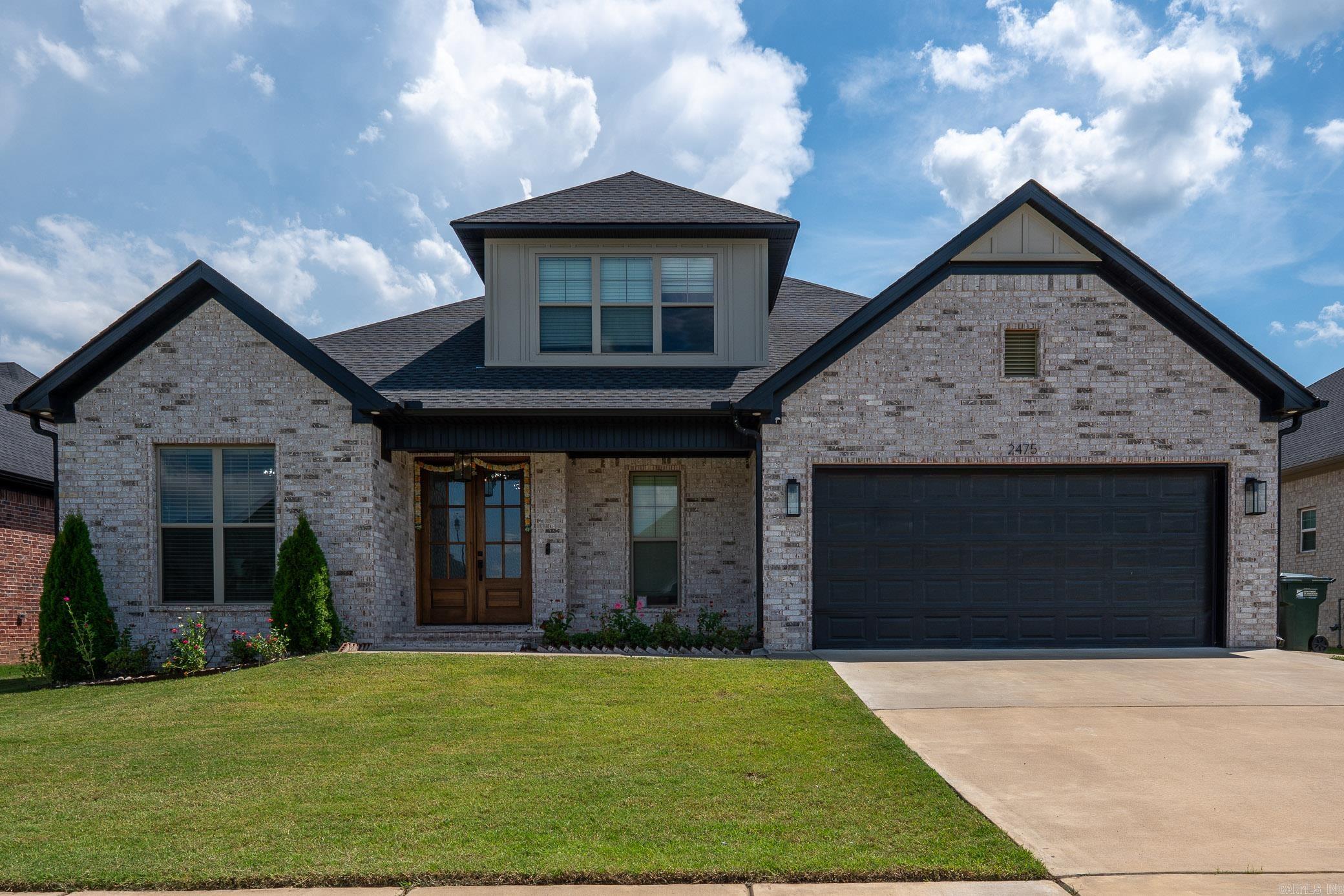 Custom-built beauty in the desirable Robynmar Subdivision! This like-new home welcomes you with soaring ceilings and a thoughtfully designed layout perfect for both everyday living and entertaining. The kitchen is a true standout with quartz countertops, a massive island, gas range, and a rare walk-around pantry that provides incredible storage and convenience. The open-concept design flows seamlessly into the spacious living area, creating a warm and inviting space to gather. The primary suite offers a relaxing retreat with a spa-like bathroom featuring upscale finishes and a huge walk-in closet with plenty of room for storage and organization. Step outside to the covered patio with an outdoor prep station and sink—perfect for cookouts and entertaining. A side golf cart garage adds extra functionality and convenience. Located in the sought-after Robynmar Subdivision, this beautiful home combines modern style, thoughtful features, and everyday comfort. Homes like this don’t come along often—schedule your showing today!