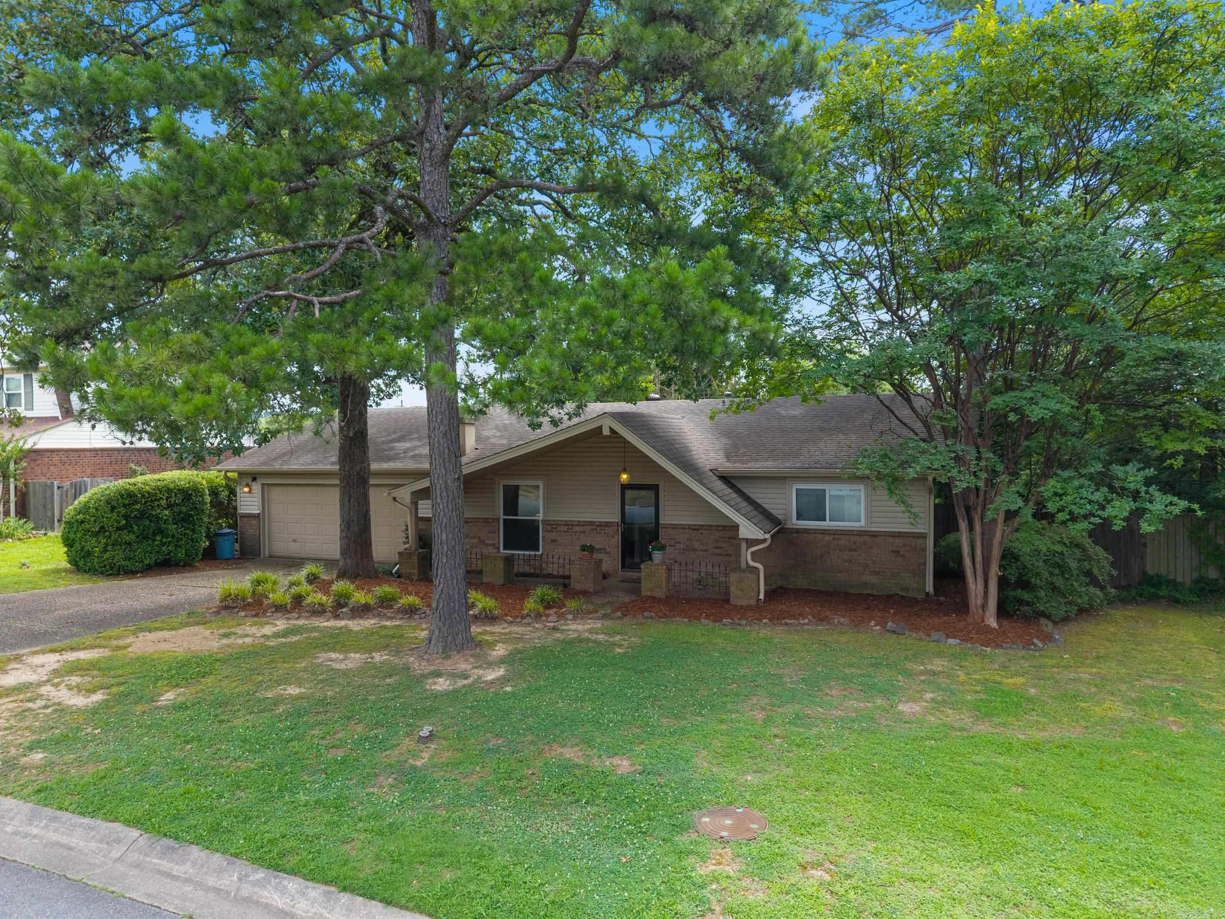 Welcome to 3921 Sierra Forest, nestled in the heart of West Little Rock. This thoughtfully laid-out three bedroom, two-bath home offers, space and convenience just minutes from the Pleasant Ridge Shopping Center, dining and other family-friendly amenities. Inside, you'll love the oversized living room with a large front window that brings in tons of natural light and gives you a great view of the yard. Equipped with a home generator, the home has been freshly painted, giving it a crisp, updated feel from the moment you walk in. The kitchen includes a cozy eat-in area and flows easily into the main living space, making it perfect for everyday living or entertaining. The primary bedroom features a large closet and an en-suite bathroom. The other two bedrooms share a full hall bath.   The fully fenced back yard is perfect for kids and pets and offers plenty of privacy, along with a spacious covered patio perfect for entertaining and relaxing.  This is a great opportunity to live in one of West Little Rock's most convenient neighborhoods.