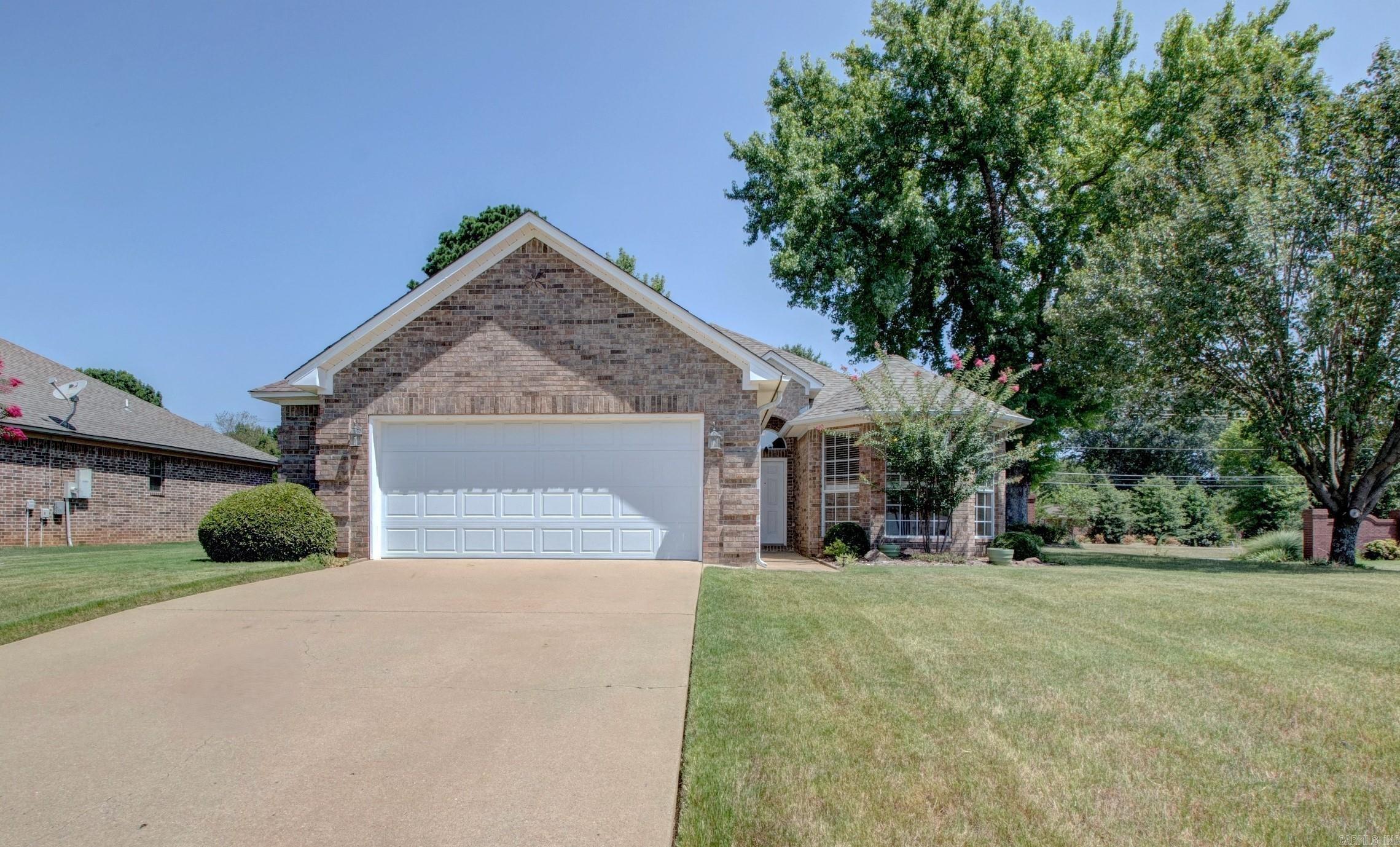 Hop on over to see this immaculately well maintained 1 owner family home built in 2007 all brick. Move In Ready. 1649 SF 4 Bedrooms 2 Full Bathrooms, on 0.25 ac corner lot. 1 Story Level Open Concept Living Design with Split Bedrooms Floorplan. Vaulted Ceilings in Living, Dining and Kitchen reach up to 16ft high and bedrooms 10ft high. Crown Molding main living areas. Very open and spacious. Frigidaire Kitchen appliances, refrigerator conveys, double pantry's, Corian countertops, window over kitchen sink a plus, lots of cabinet space. Luxury Wood Plank Flooring and floor Tile in all wet areas. Living Room gas logs fireplace, electric wall switch. Primary Suite offers a luxury bathroom with double sink vanity, walk in shower, soaking tub and spacious walk in closet. Roof Replaced 2018, HVAC Condensing Unit 2020, Air Handler and Gas Furnace well serviced and properly functioning. Rheem 50 gallon Gas Water Heater 2024. Laundry Room next to kitchen going to garage. 2 Windows getting replaced. Vivint Doorbell with Security System. Covered Patio with gas grill connection. Backyard OASIS with stunning Professional Gardener Landscaping meticulously maintained through the years.