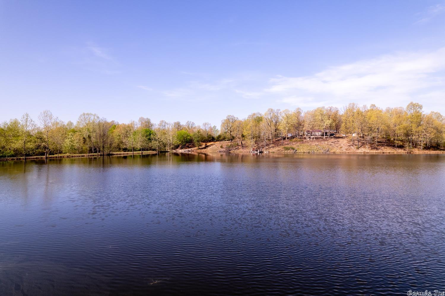 OZARKS CATTLE RANCH WITH LAKE AND CABIN NEAR SALEM ARKANSAS Property is located on Candlewood Rd, Viola, AR. This 276 acre ranch includes a 7 acre spring fed lake stocked with fish. Also has a 2 bedroom cabin that sits on the side of the lake. There is a drilled well and private septic system. High speed internet is also available with NEXT. It has approximately 230 acres of pastureland that is fenced and cross fenced. It has a year around creek, 2 springs and 5 ponds. There is a newer pipe corral and cattle working facility. Also includes an older corral. There are several vista hilltop views with great building sites. It has an abundance of wildlife including whitetail deer and turkey. Lake Norfork, Spring River and the world famous White River are all within 30-45 minutes of the property. The property has a great location and is a little over a mile off of US Hwy. 62-412 just outside of Salem.  Also includes a couple of storage sheds, old farm house and outbuildings. Wild fowl including geese and ducks frequent the lake. It is not uncommon to see a Bald Eagle during winter months. Great equine property or retreat property. Near Lake Norfork, White & Spring River.