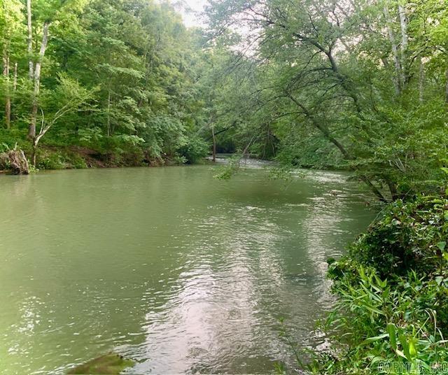 Say hello to this beautiful CREEK property! Discover the possibilities of this beautiful 16 acres of unrestricted and usable property with a year round creek. Enjoy listening to the creek run and all the beautiful wildlife. Build your dream home. Great place for a hobby farm, or a peaceful vacation home. Lots of wonderful possibilities. There is an old home on the property that could possibly be restored. There is also a detached garage on a concrete slab. The home has the convenience of running city water as well as a well and two septic tanks. There is also a barn on the property for livestock or whatever you want to use it for. You have to see this one for your self! Get your appointment today!